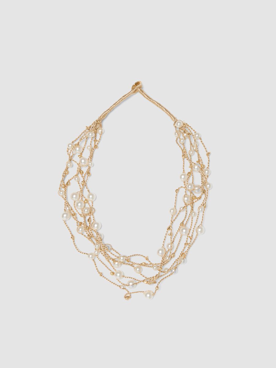 Collana beige con perle e fili intrecciati_0