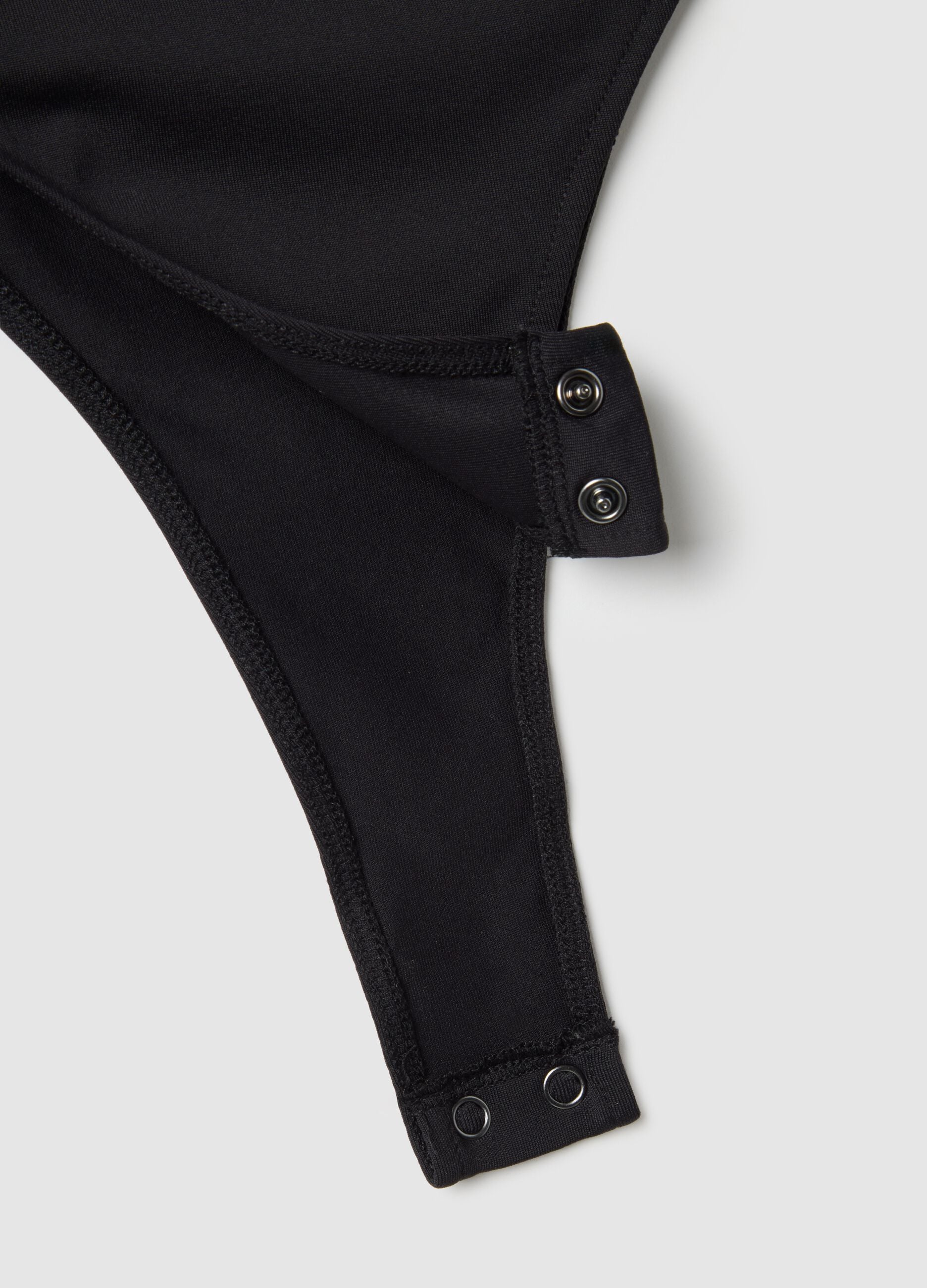 Black slim fit bodysuit with sheer accents