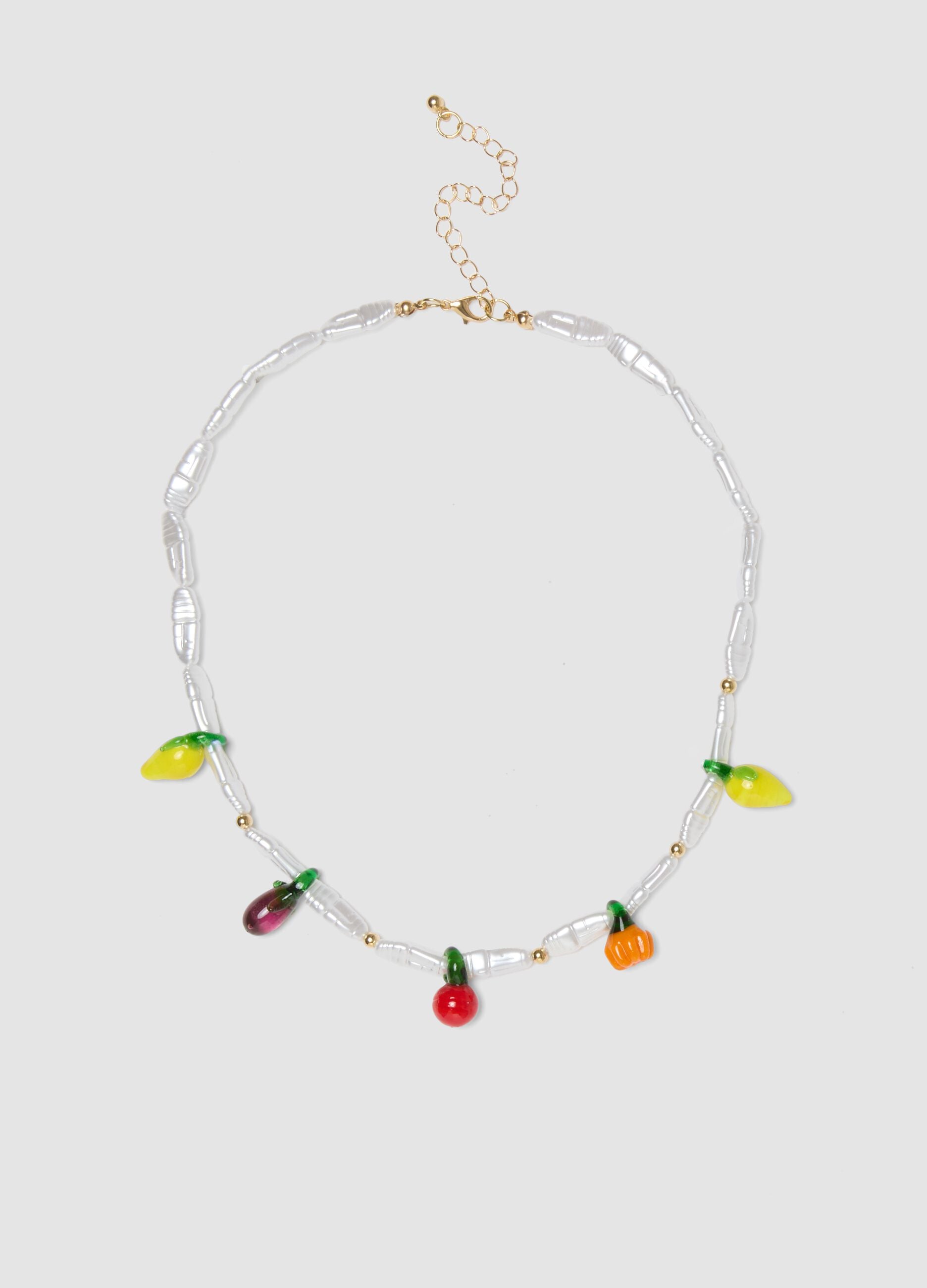 Necklace with transparent beads and fruit-shaped charms
