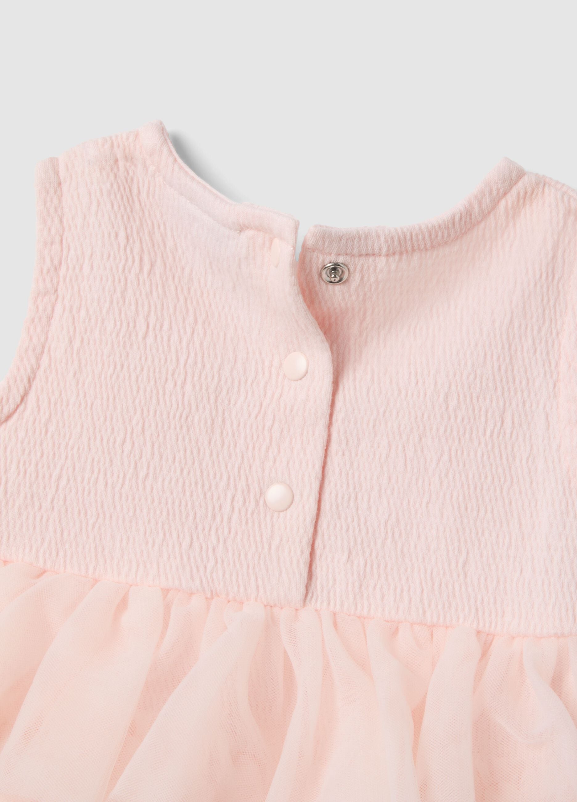 Pink stretchy cotton baby romper with ruffles