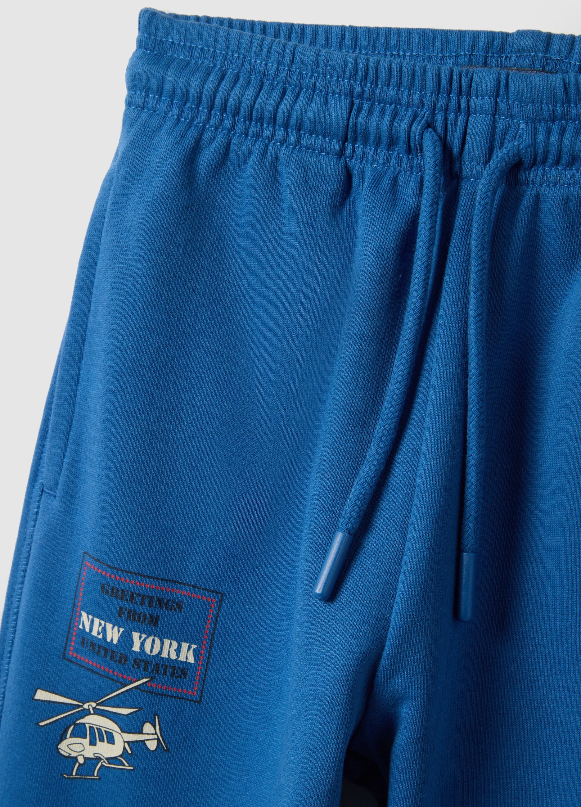 Children's blue jogger trousers in pure cotton regular fit with logo