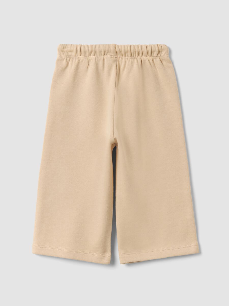 Beige pure cotton trousers with elasticated waist and print for baby girl_1