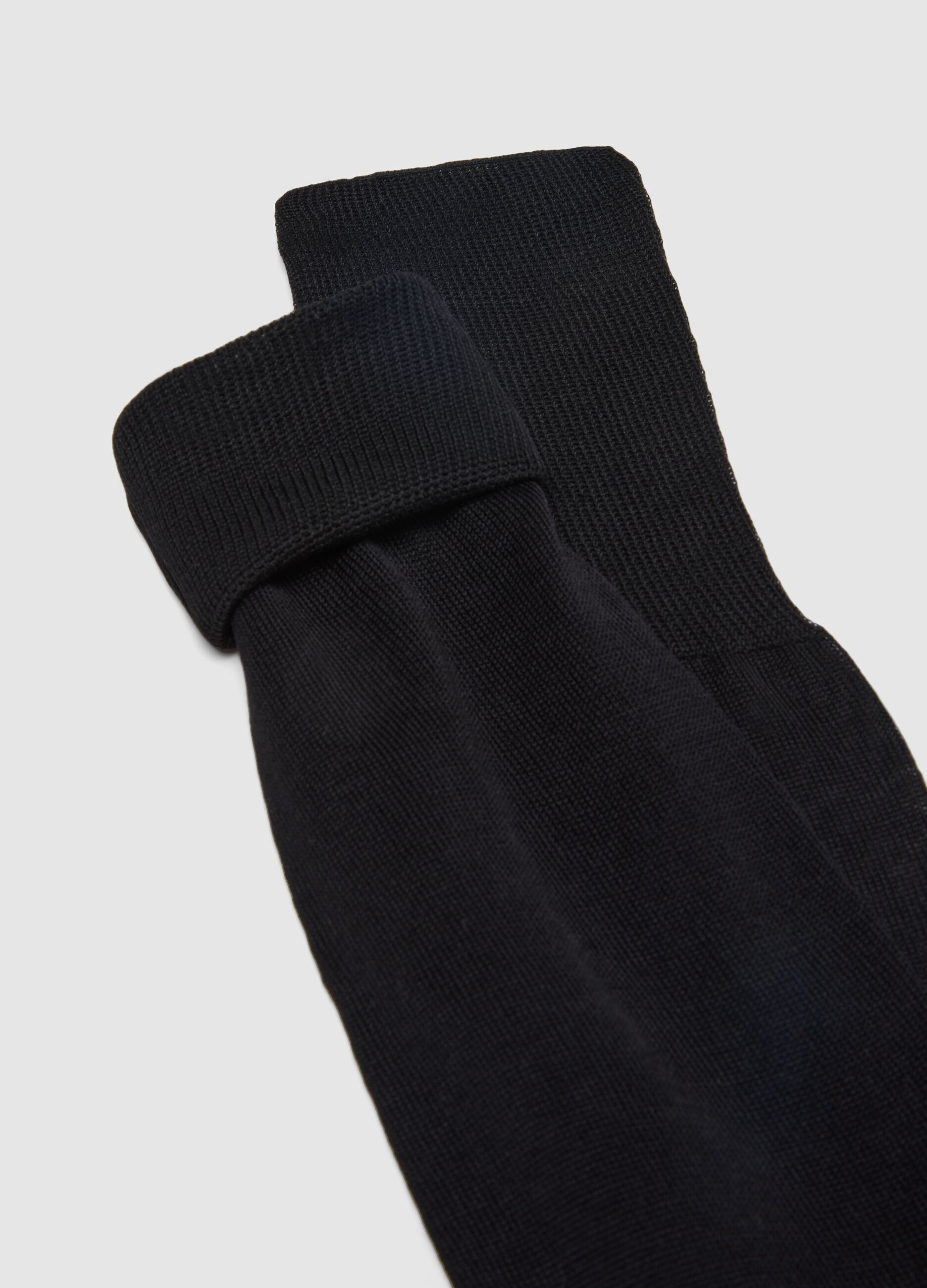 Three-pack long socks in pure black cotton regular fit