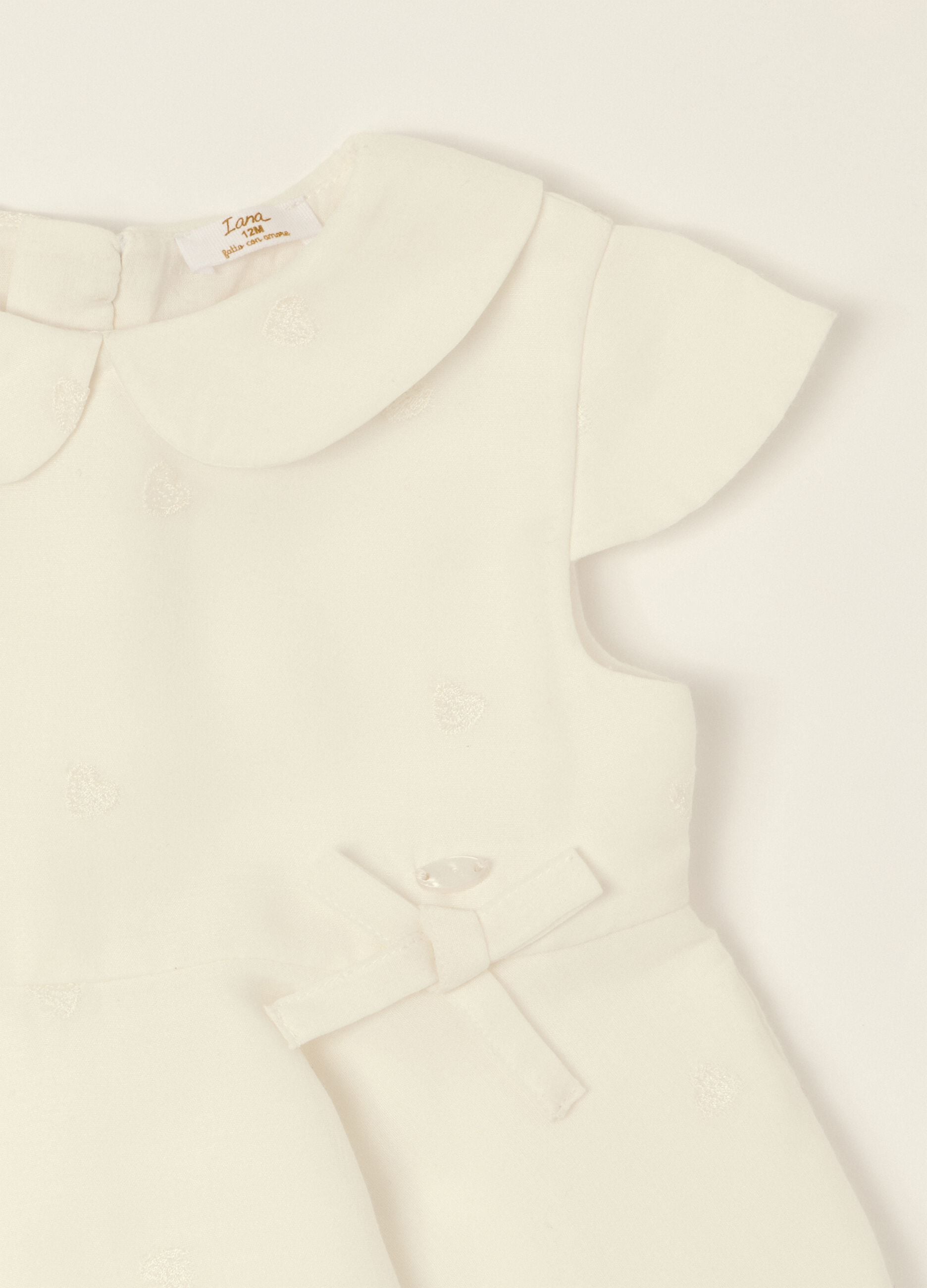 White dress with embroidered details