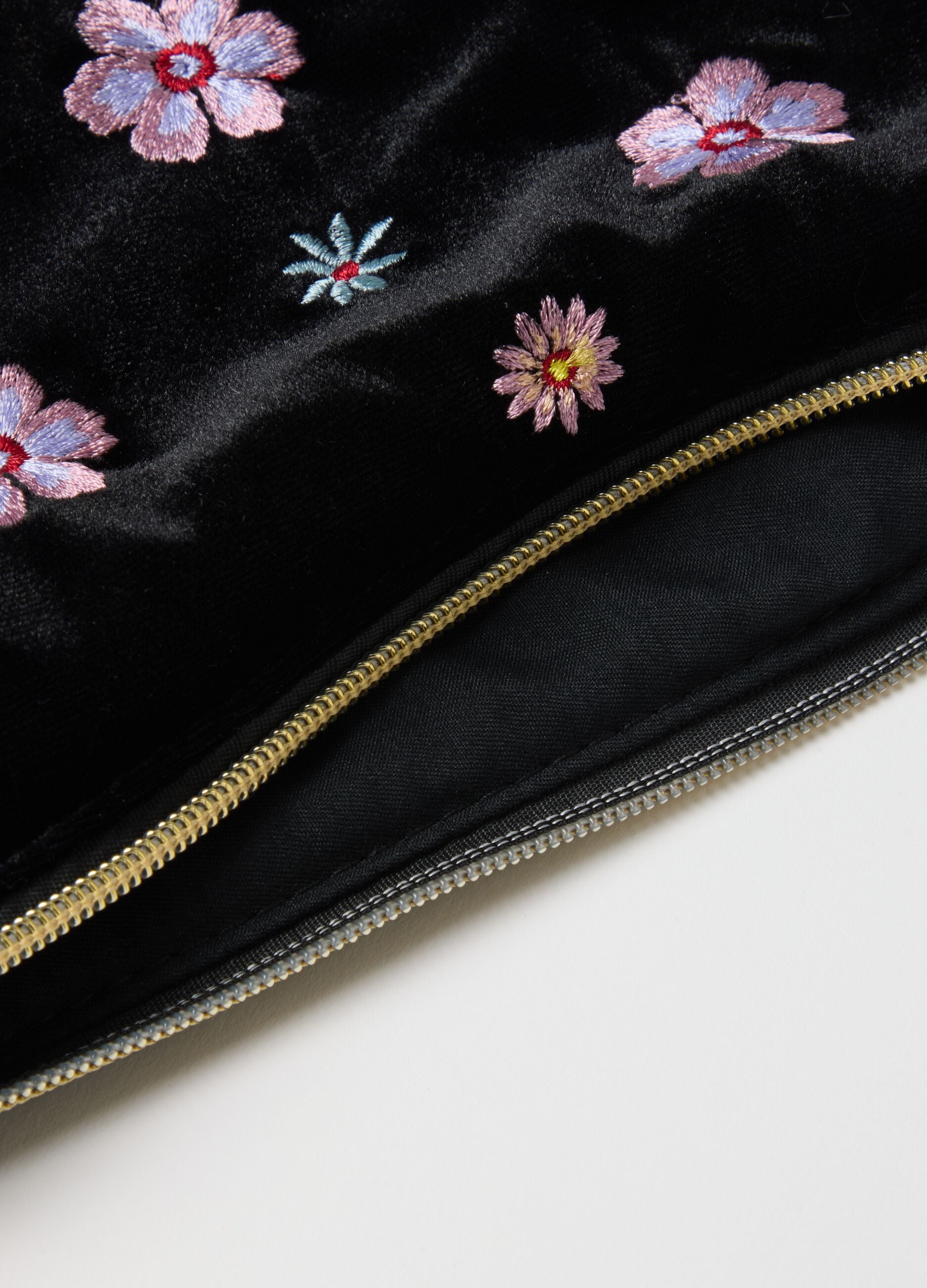 Black shoulder bag with floral embroidery and zip