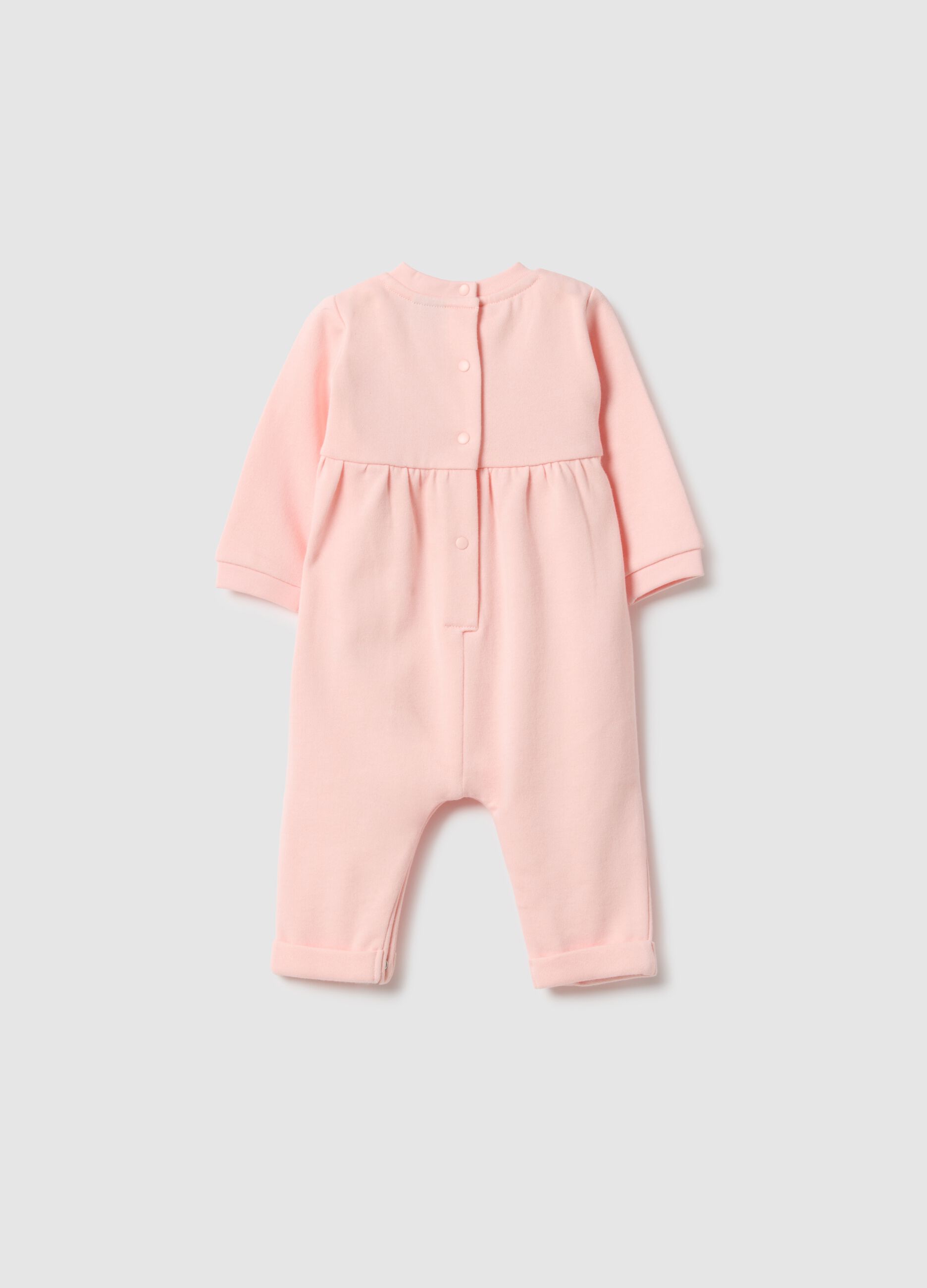 Baby girl's pink cotton sleepsuit with embroidered details