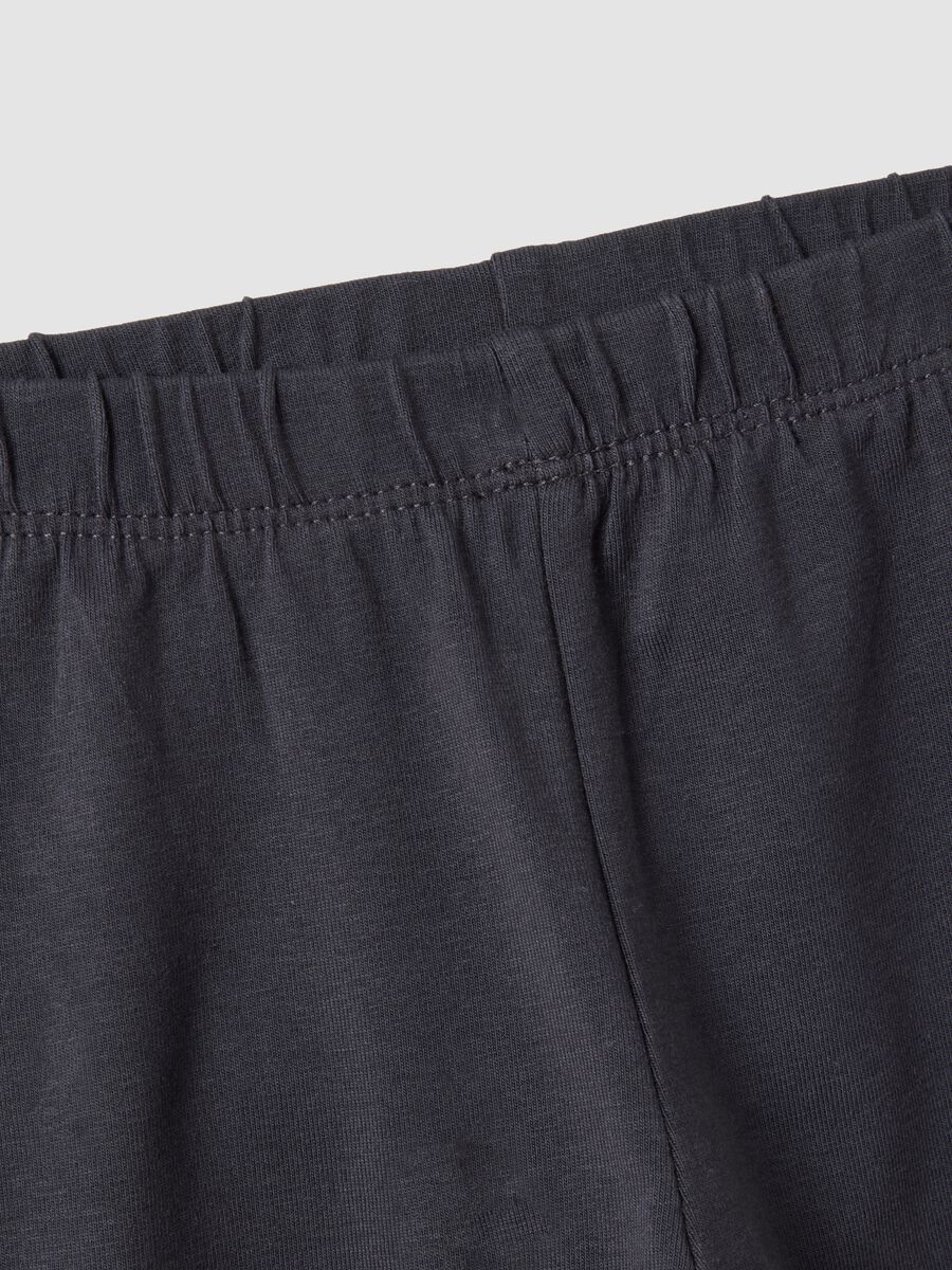 Black flared leggings in stretchy organic cotton blend with heart print for baby girl_2