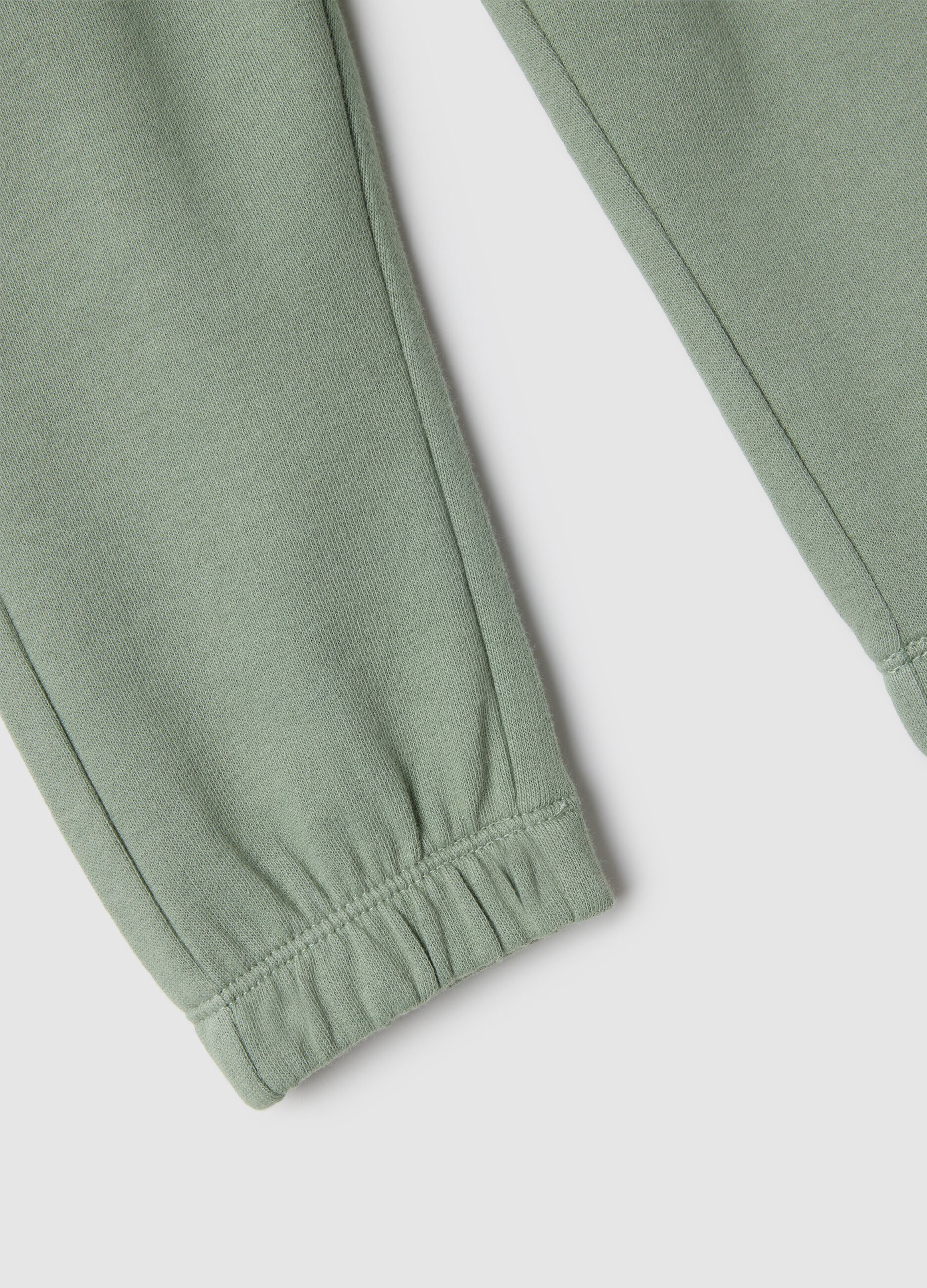 Kids' regular fit green jogger trousers in pure cotton