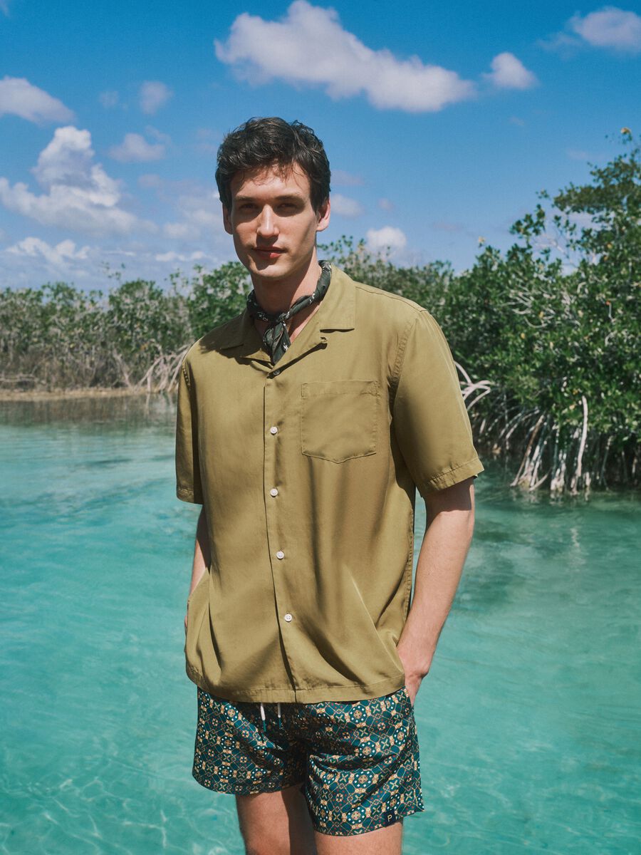 Green patterned swim shorts with elasticated waist_1