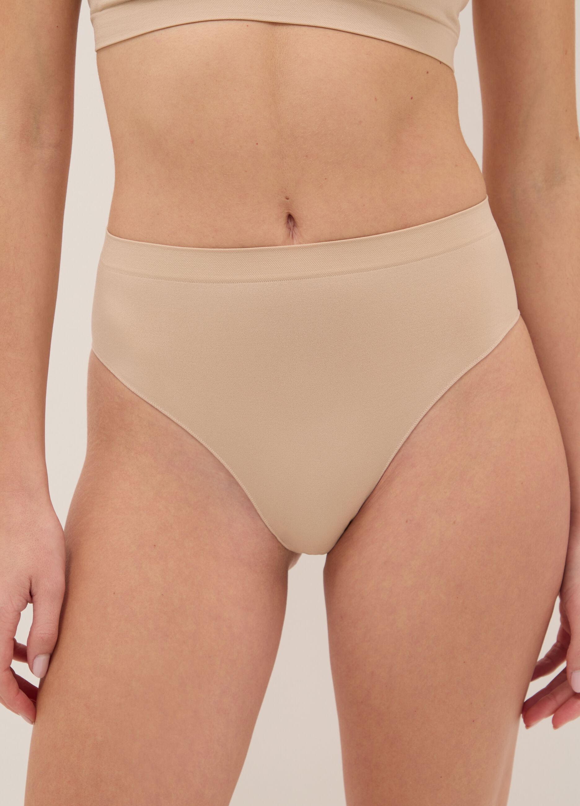 High-waisted stretchy beige fabric briefs
