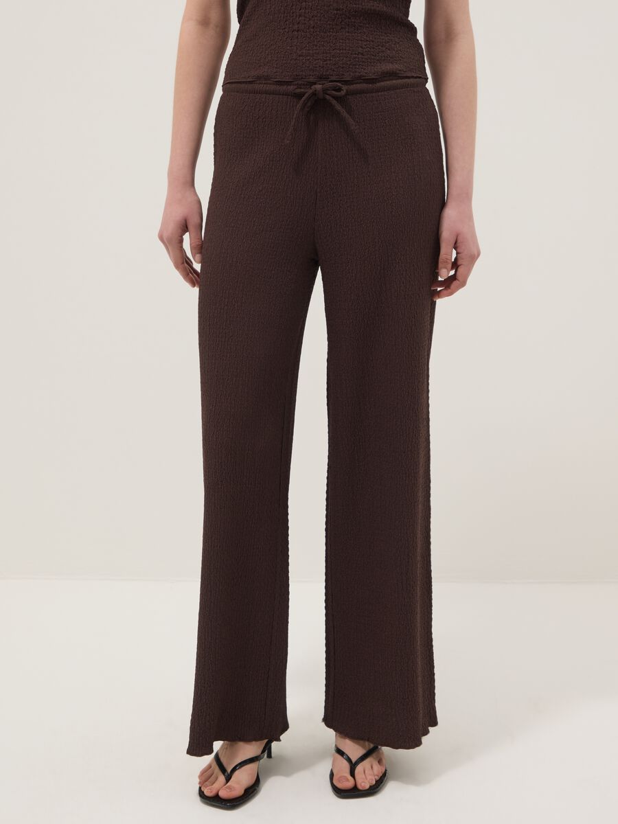 Brown stretch wide-leg trousers with crinkled texture_1
