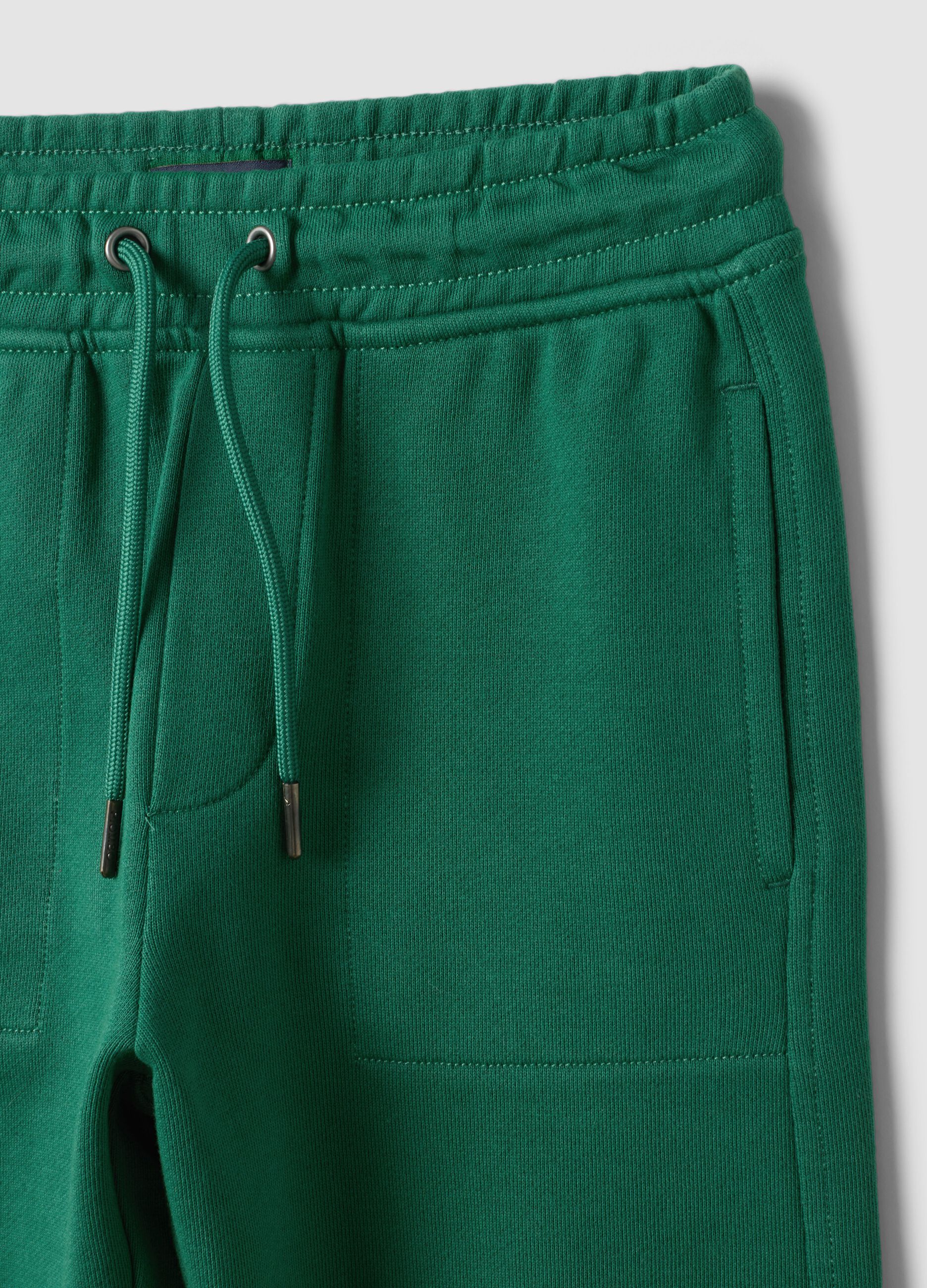 Green pure cotton jogger trousers with elasticated waist for boys