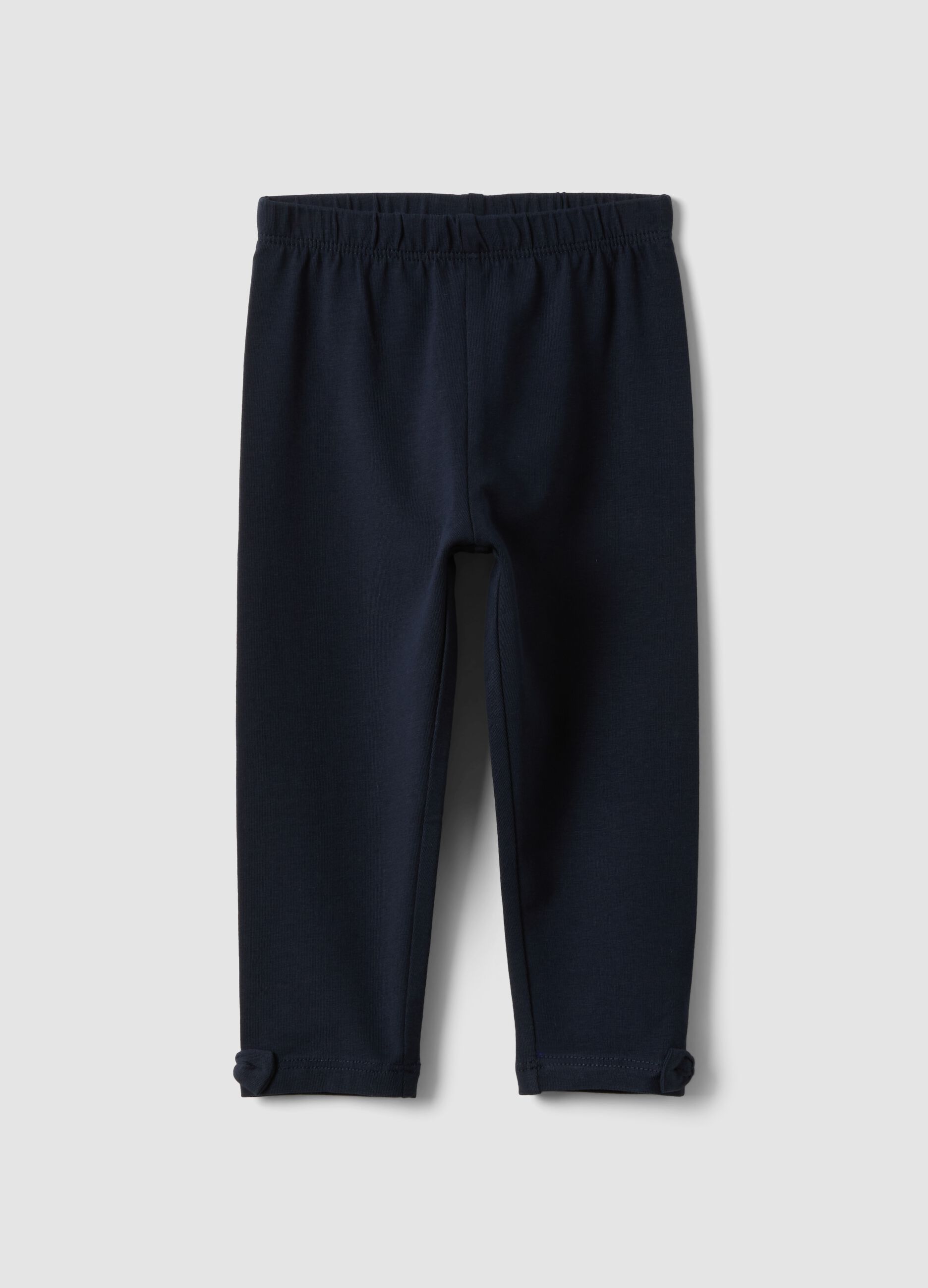 Blue stretch organic cotton leggings with bows for baby girl