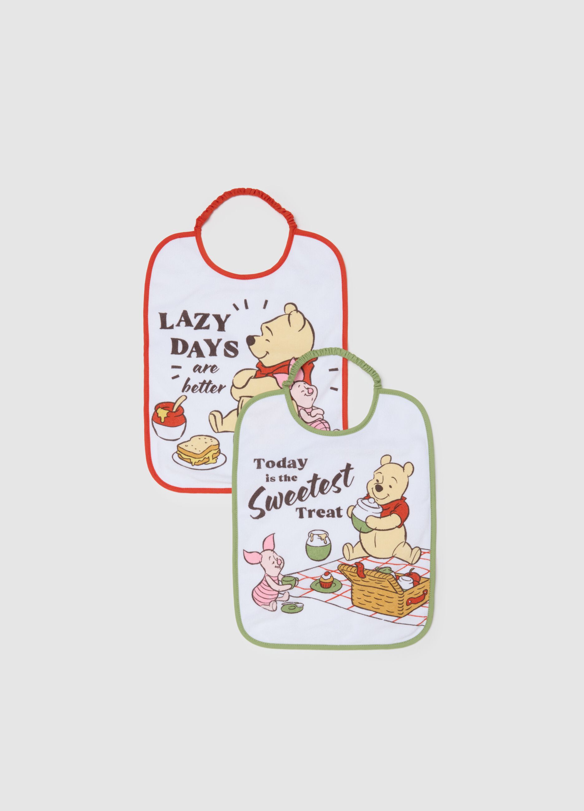 Twin-pack of white cotton mix bibs for newborn girls with Winnie the Pooh