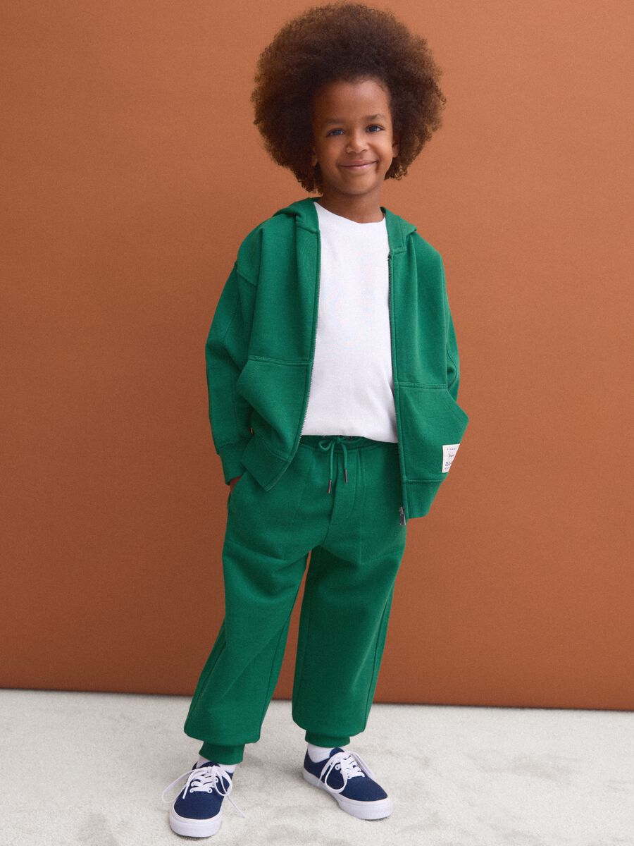 Green pure cotton jogger trousers with elasticated waist for boys_1