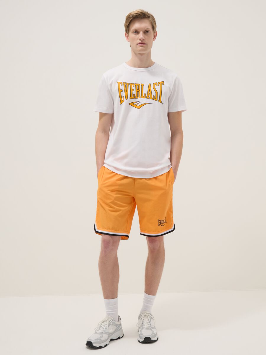 Orange regular fit sports shorts with white and black details_0