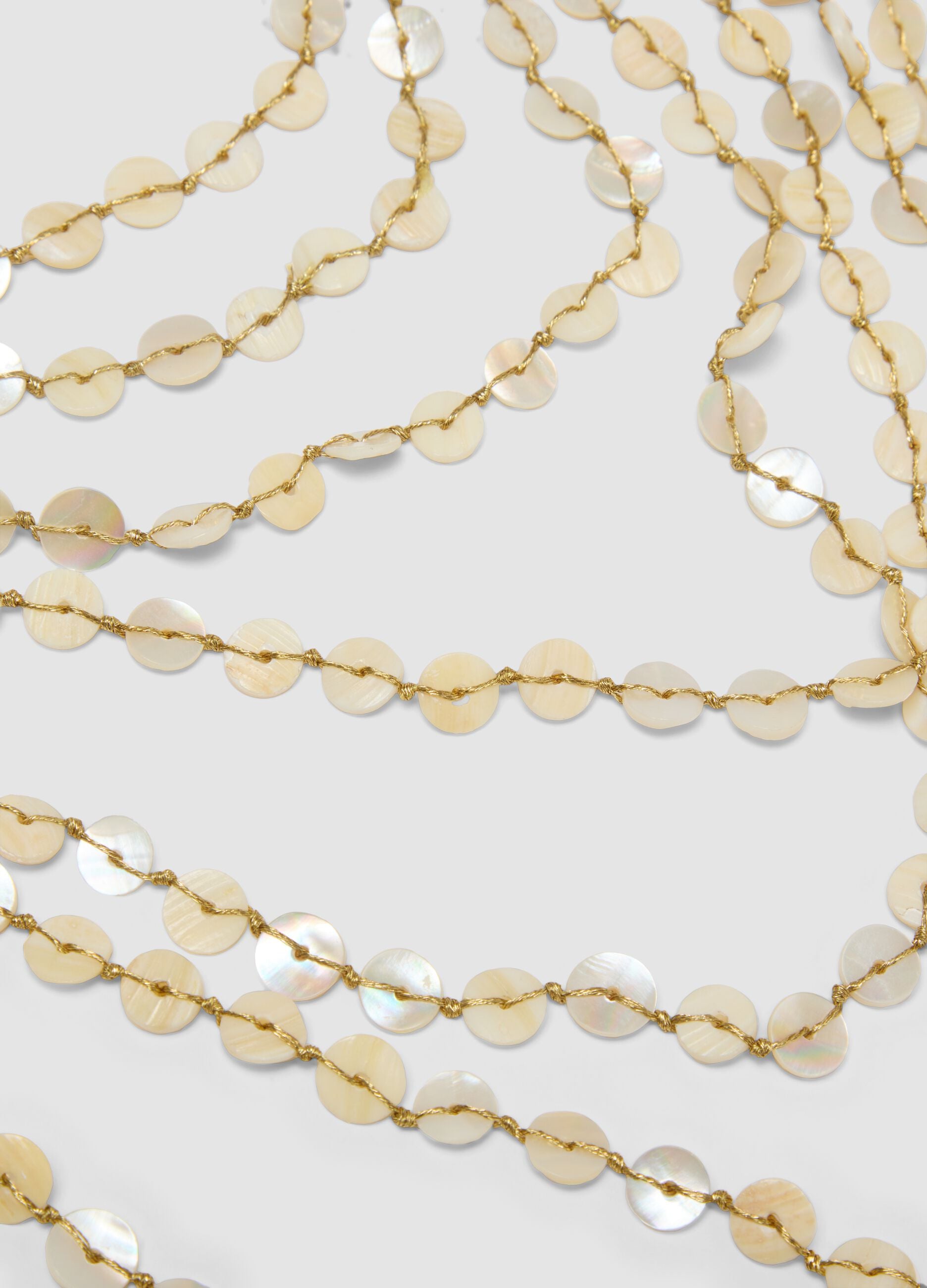 Beige multi-strand necklace with pearlescent discs