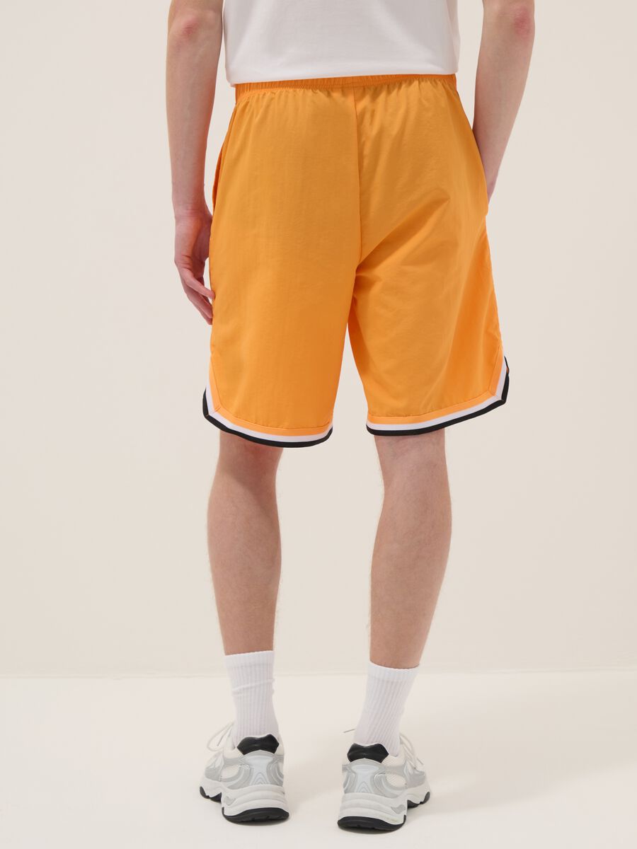 Orange regular fit sports shorts with white and black details_2