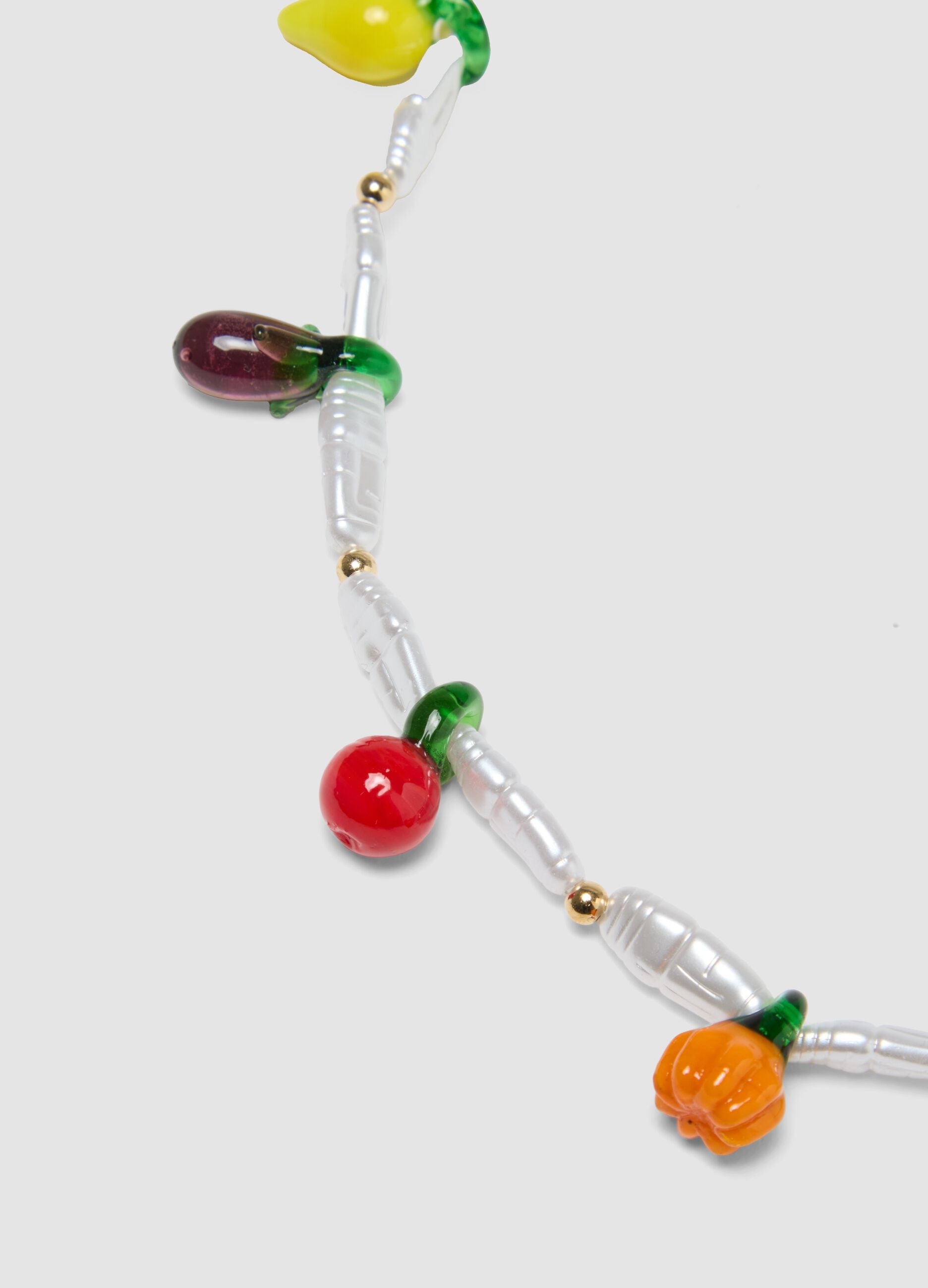 Necklace with transparent beads and fruit-shaped charms
