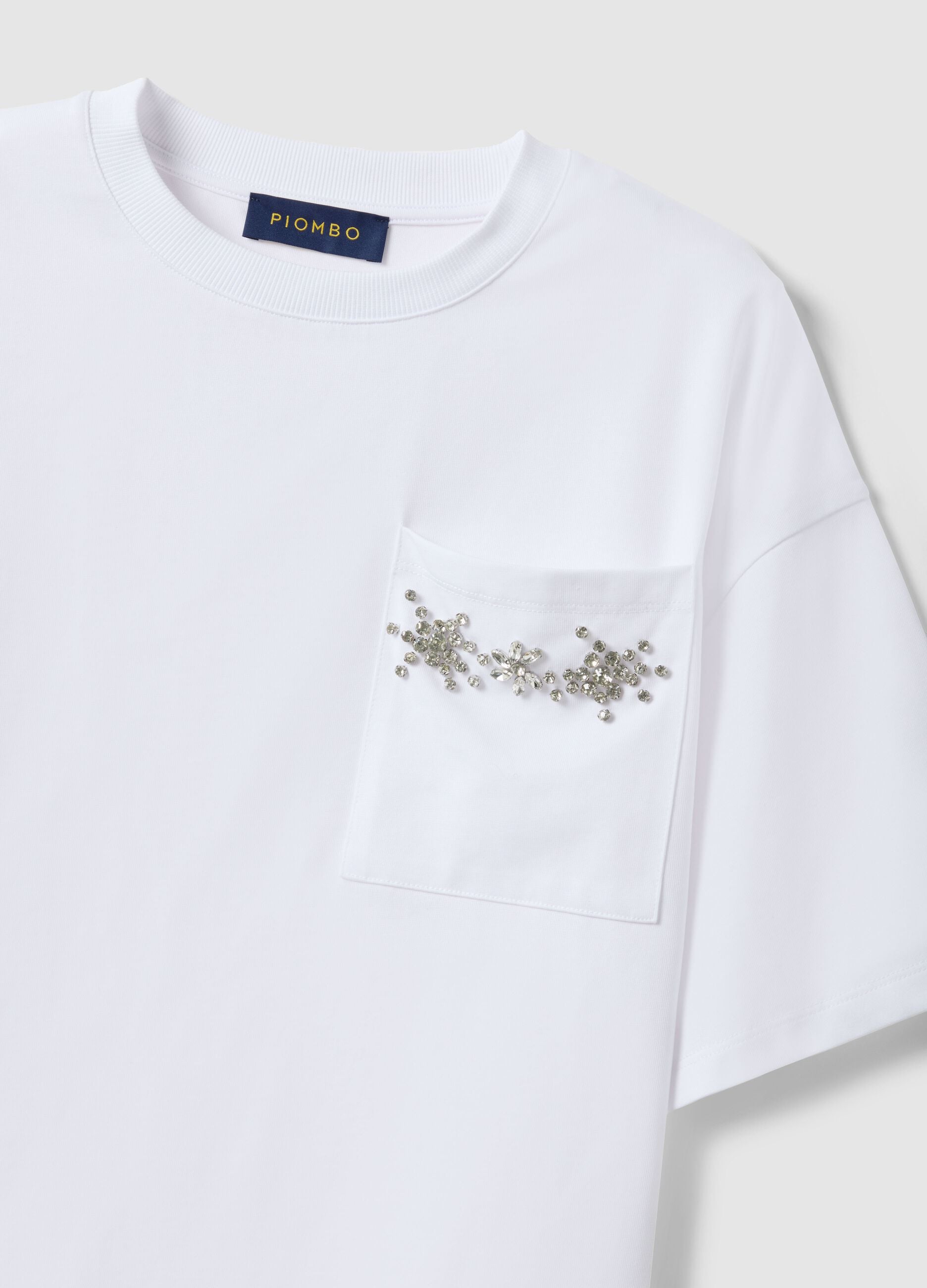 White cotton blend relaxed fit T-shirt with decorative pocket
