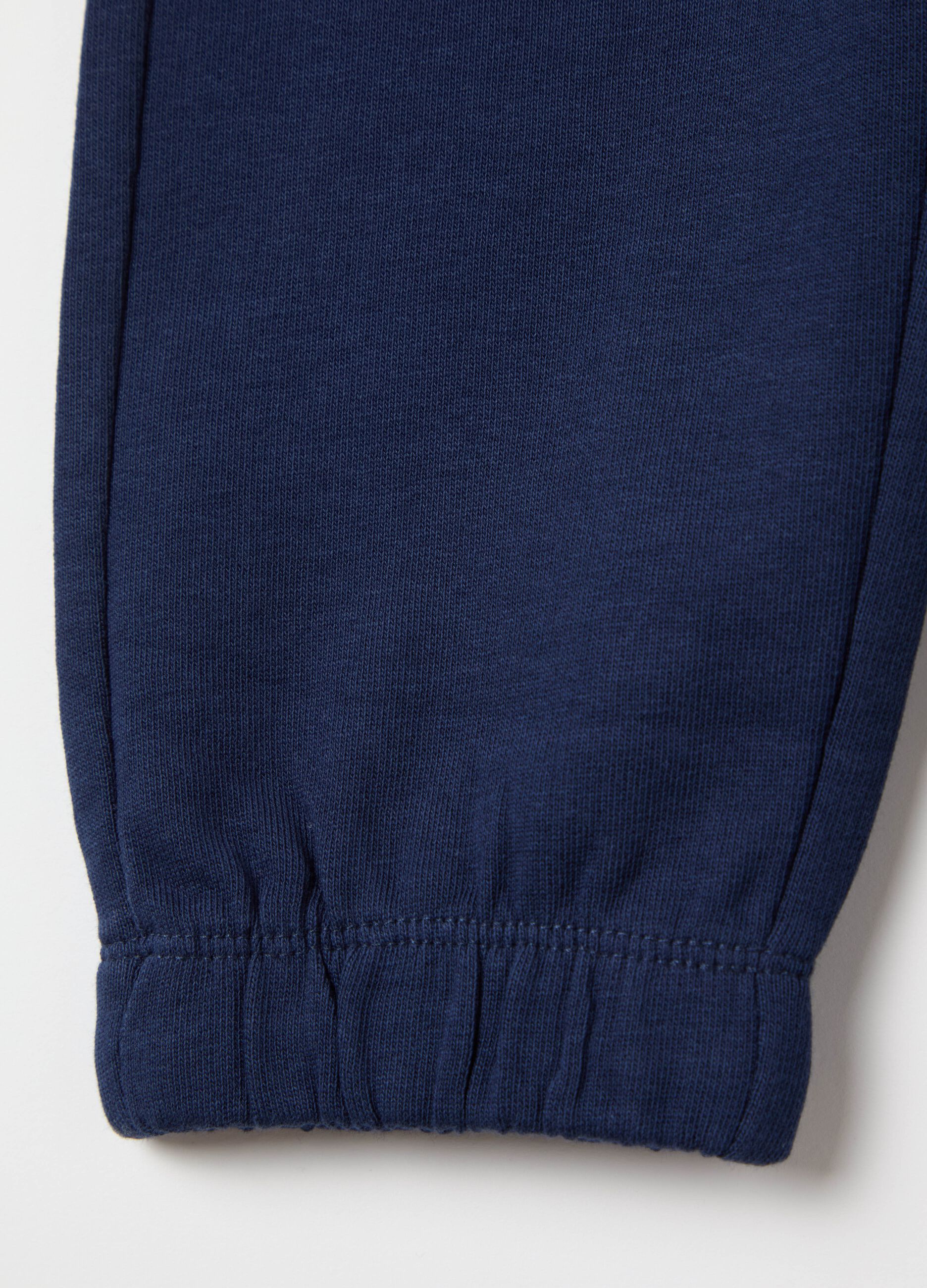 Joggers with drawstring and dinosaur print
