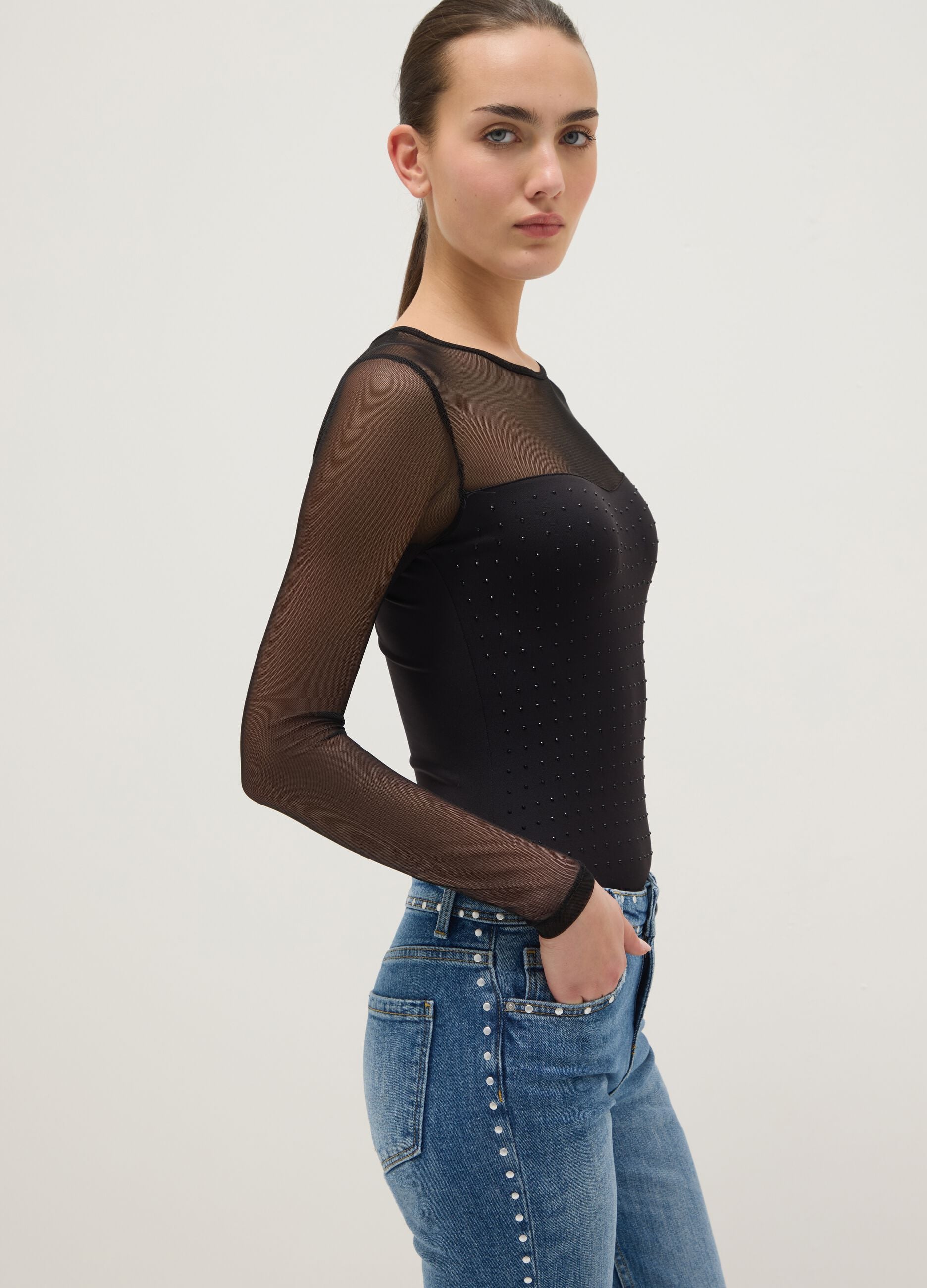 Black slim fit bodysuit with sheer accents