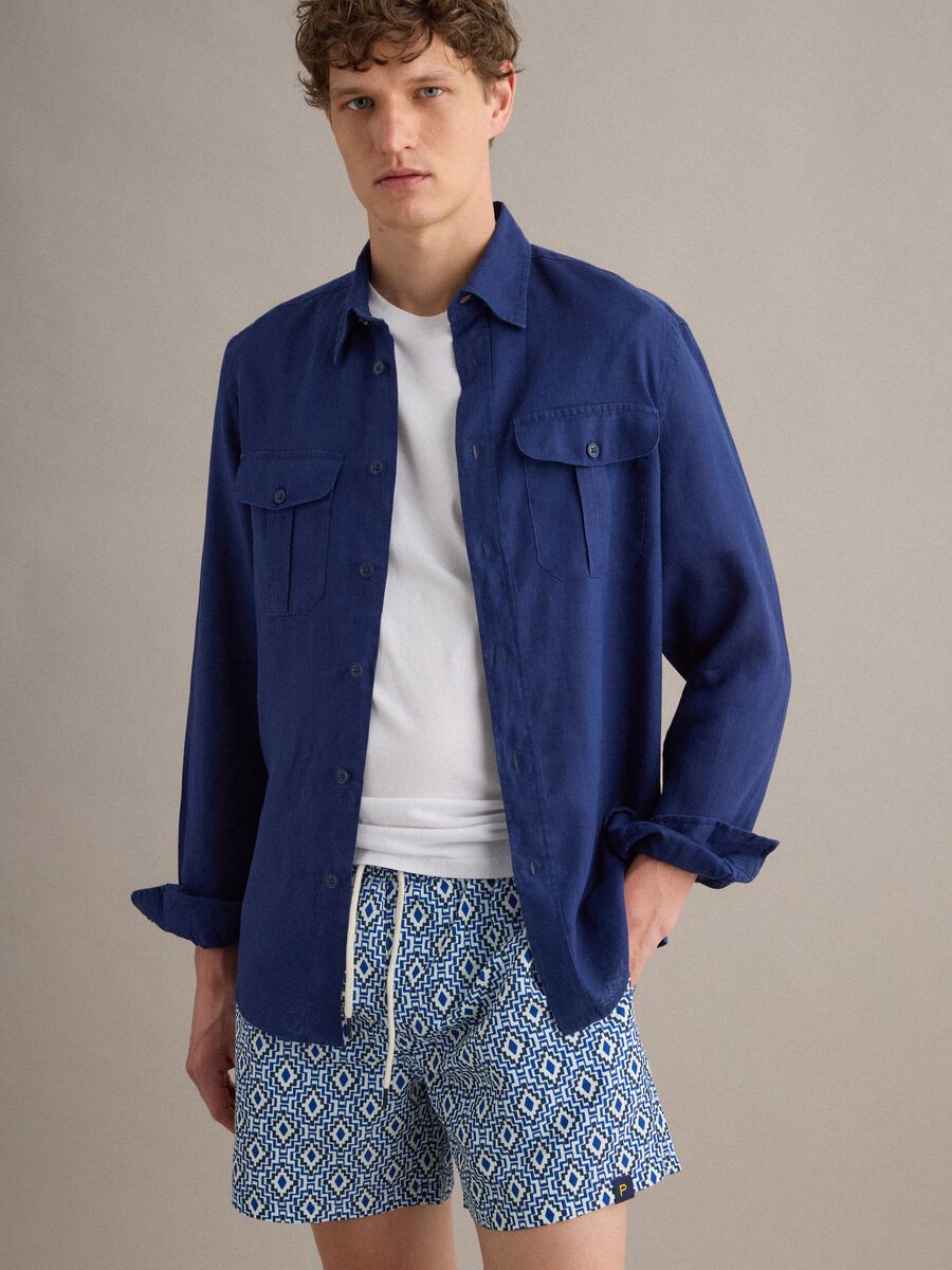 Blue swim shorts with geometric print_0