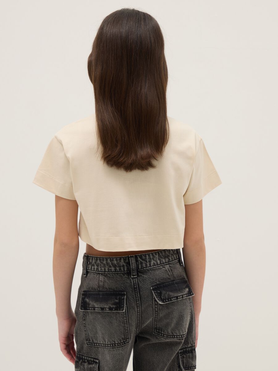 Pure cotton beige boxy fit girl's t-shirt with camouflage pocket_1