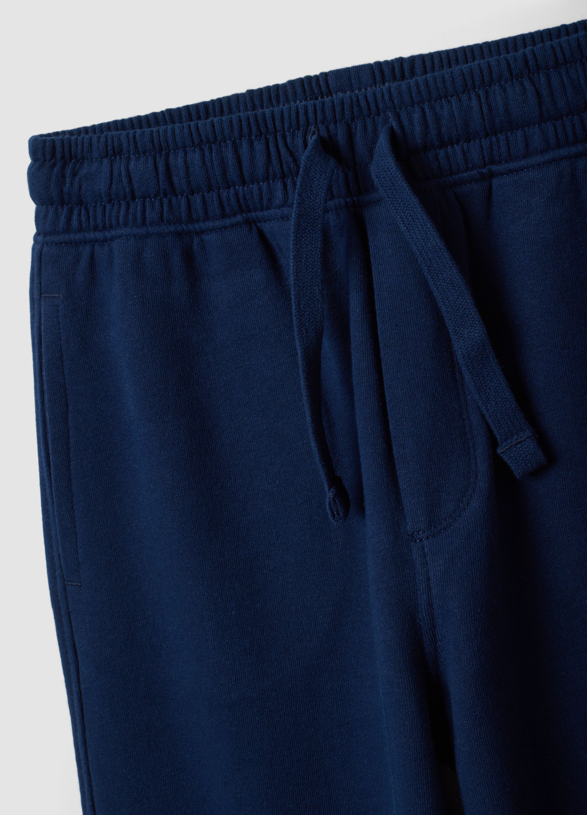 Pantaloni jogger blu in puro cotone organico con tasche cargo per bambino
