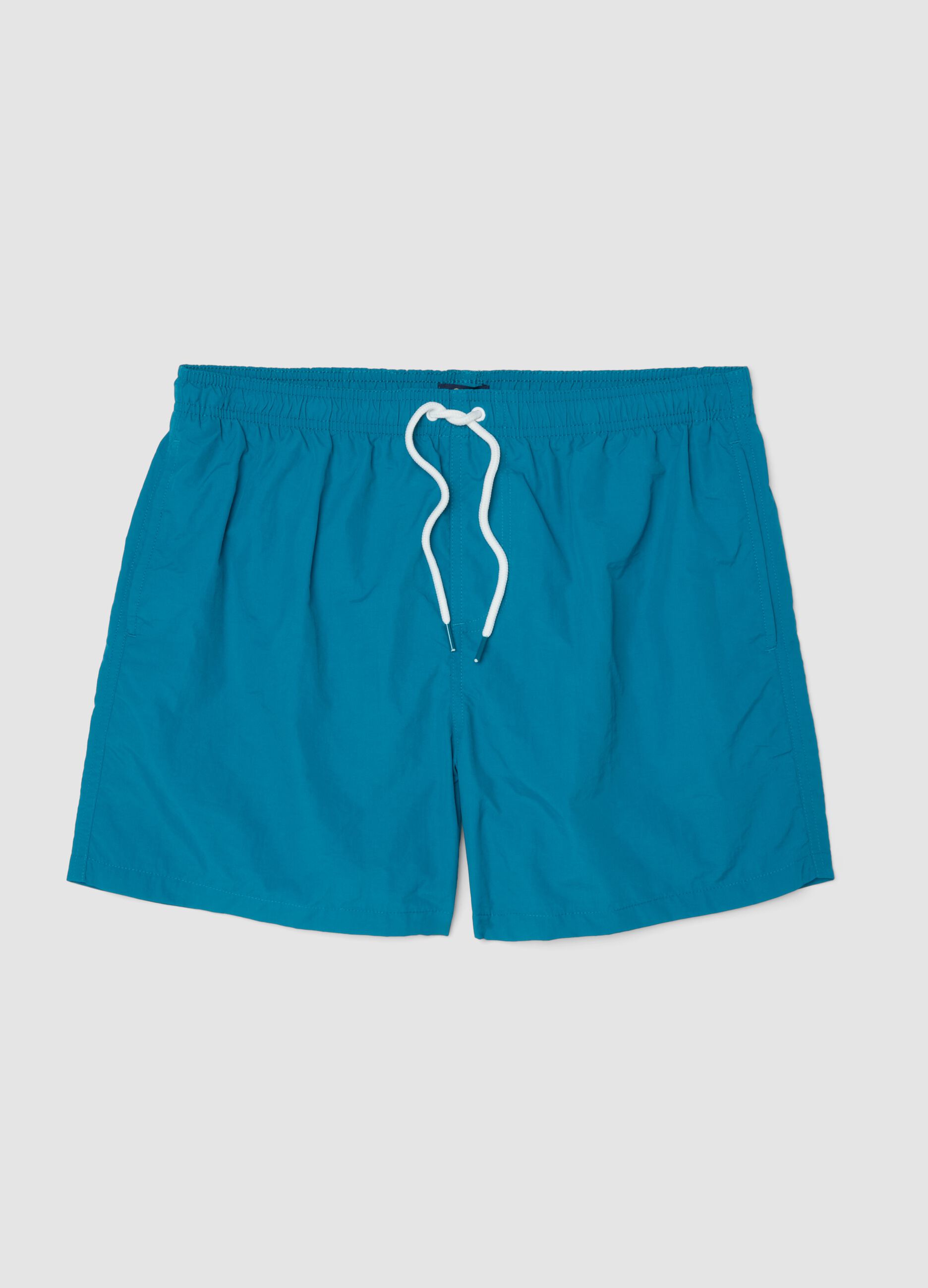 Blue swim shorts with elasticated waist