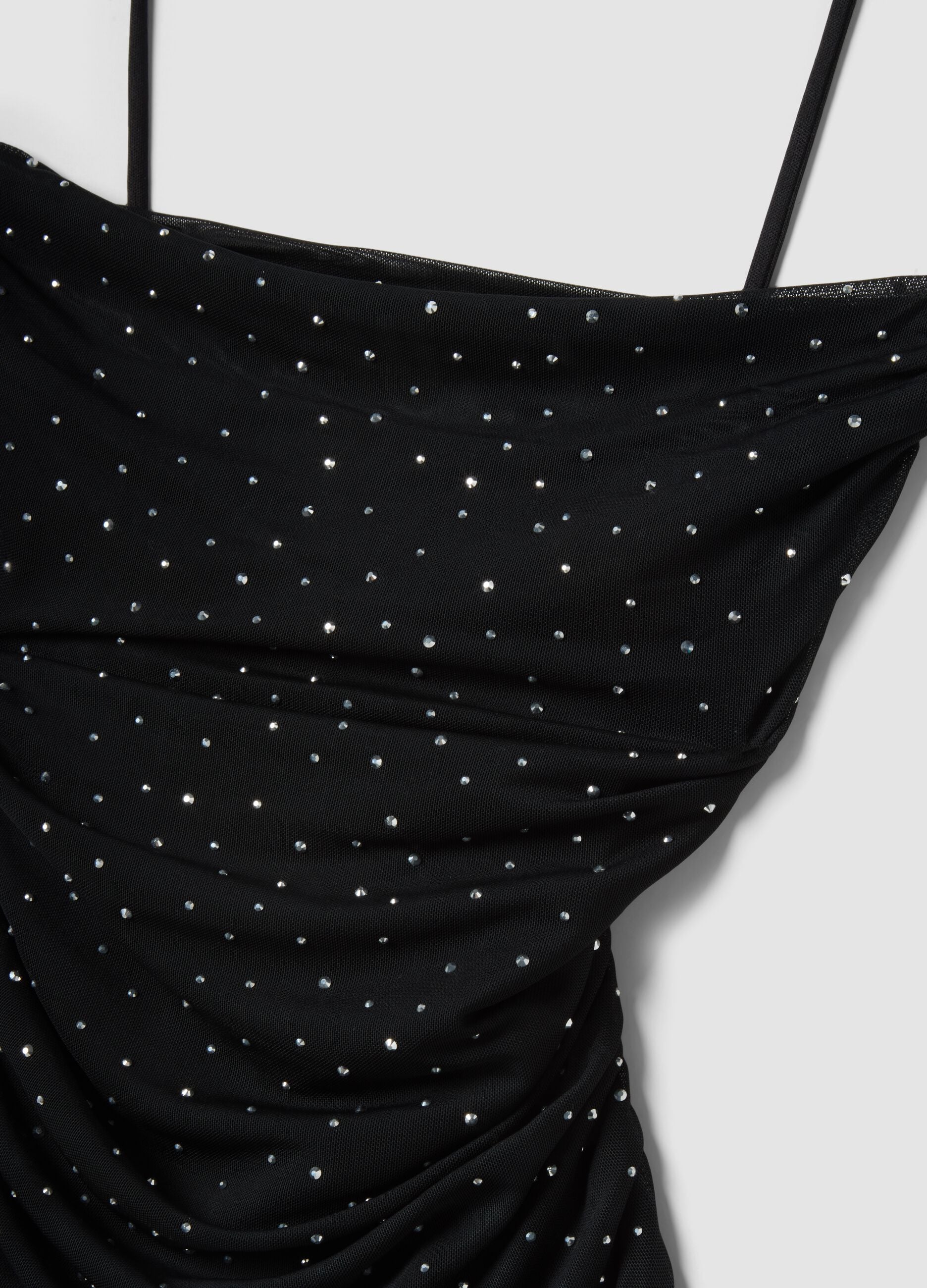 Black mini dress in stretch fabric with rhinestones