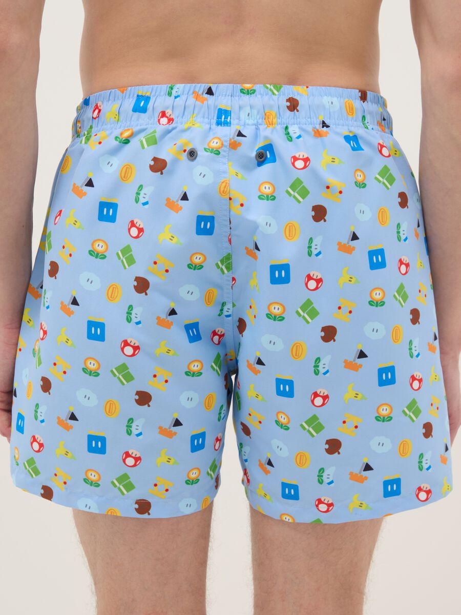 Blue swim shorts with Super Mario prints_2