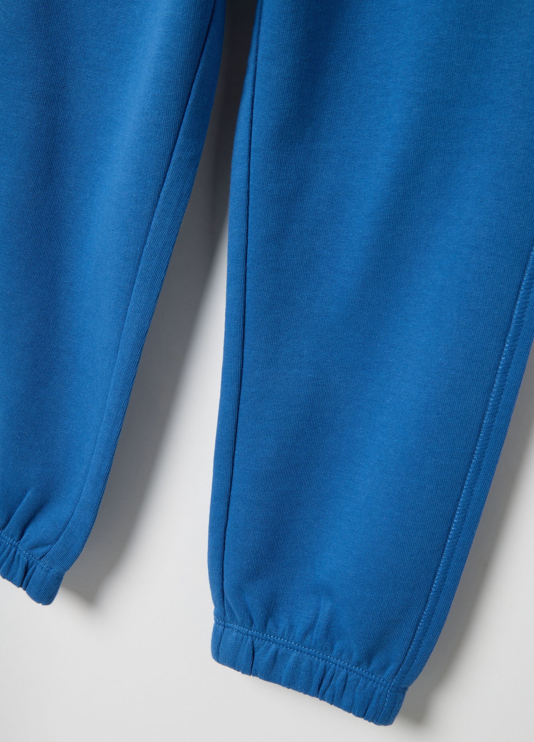 Children's blue jogger trousers in pure cotton regular fit with logo