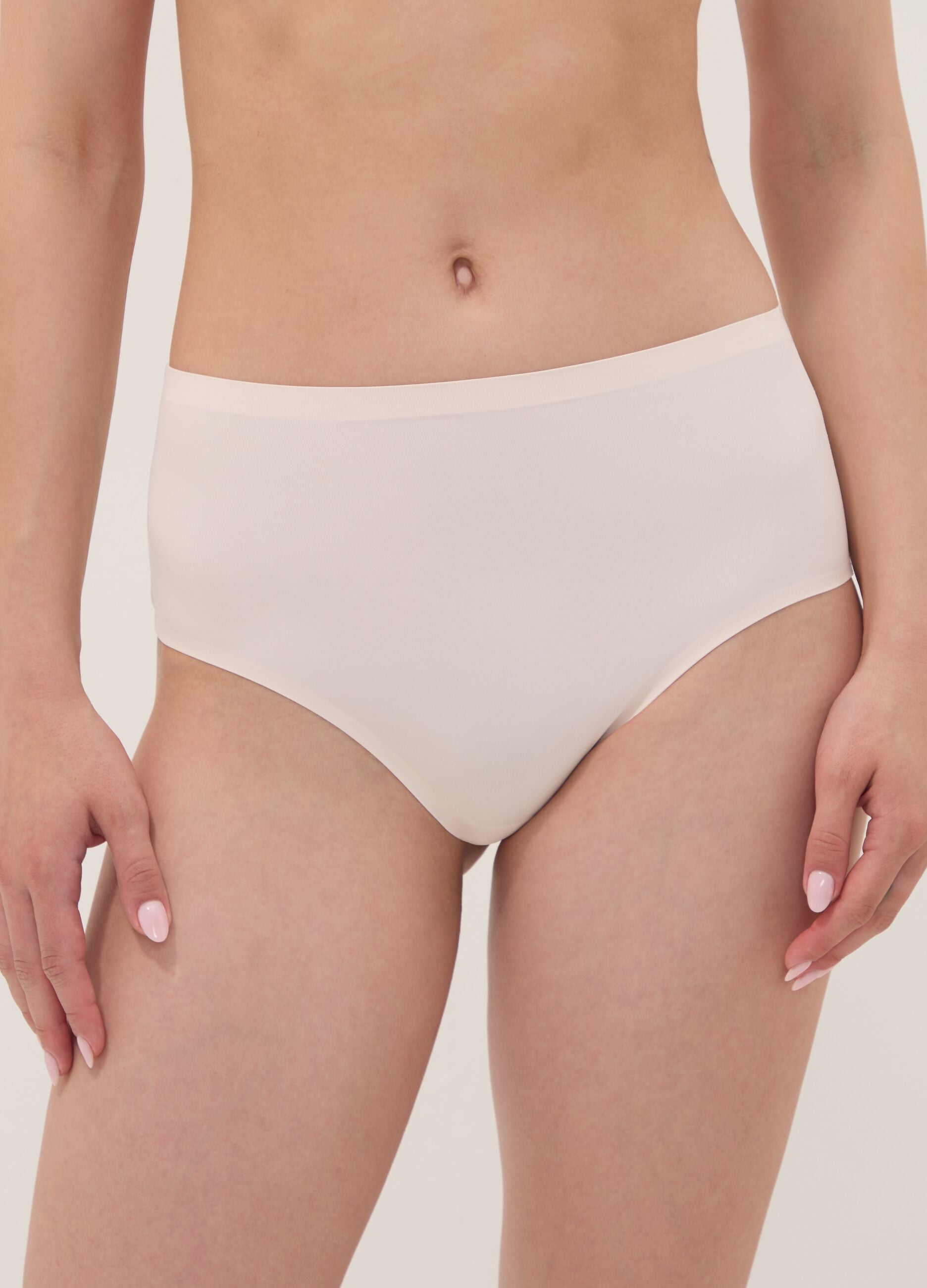 Pink high-waisted Brazilian briefs in stretch fabric with a shaping effect