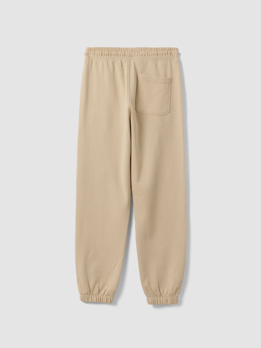 Jogger beige in puro cotone con stampa comfort fit per ragazzo_1