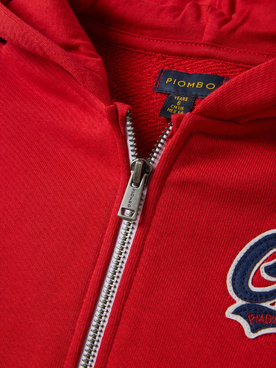 Red organic cotton hoodie with embroidered details, oversized fit, for boys_1