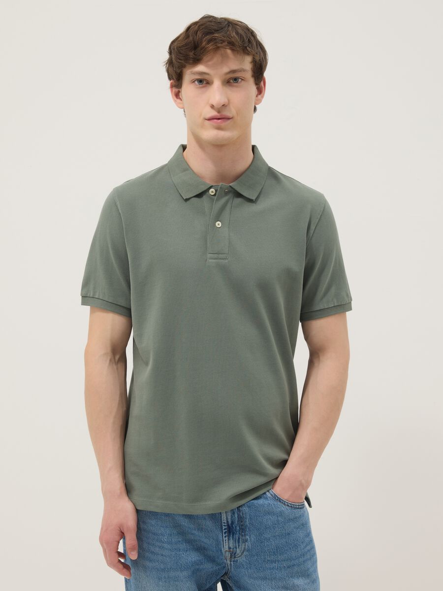 Green short-sleeved polo shirt in pure organic cotton_0