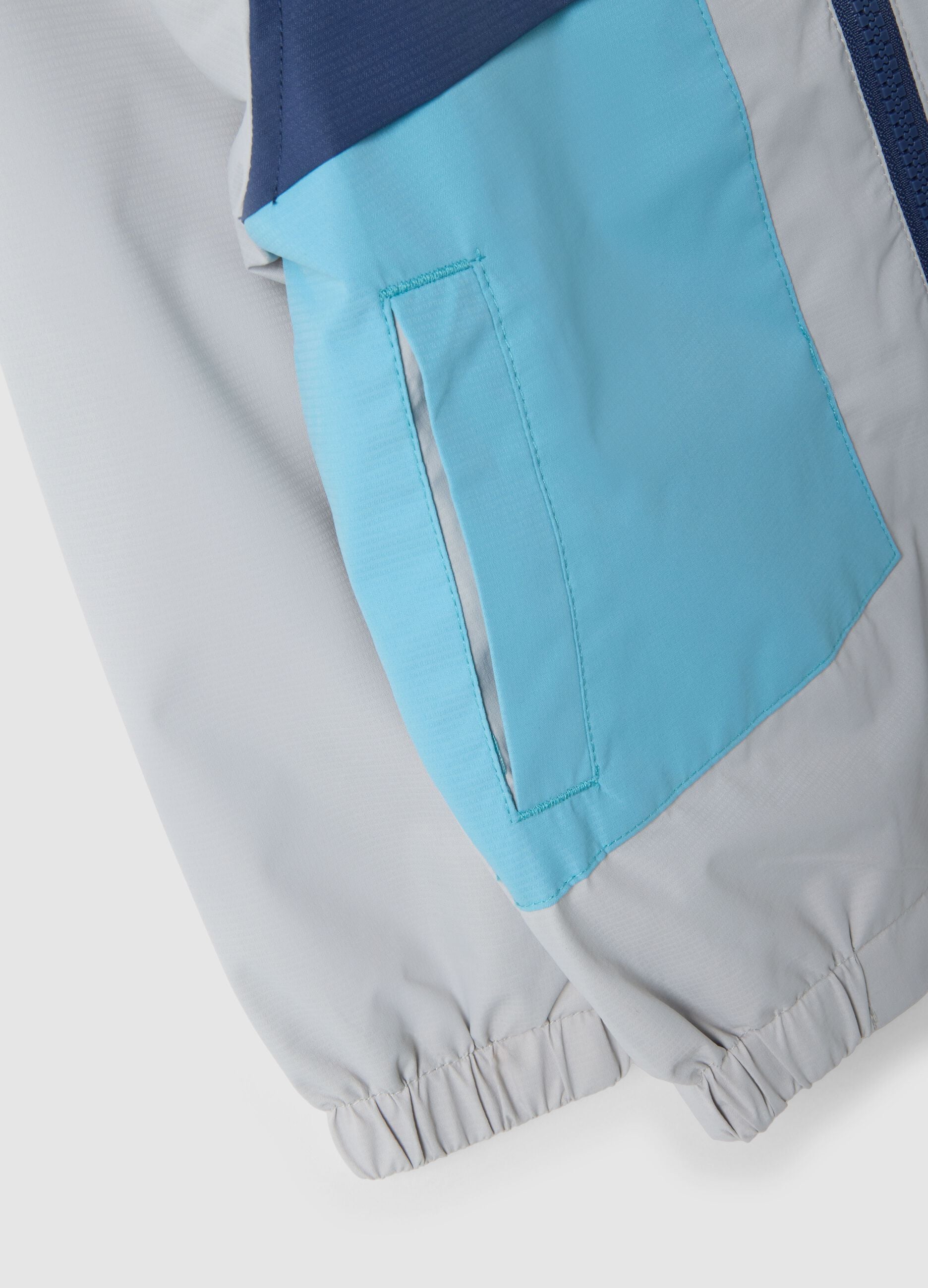 Multicoloured waterproof jacket with hood and zip for children