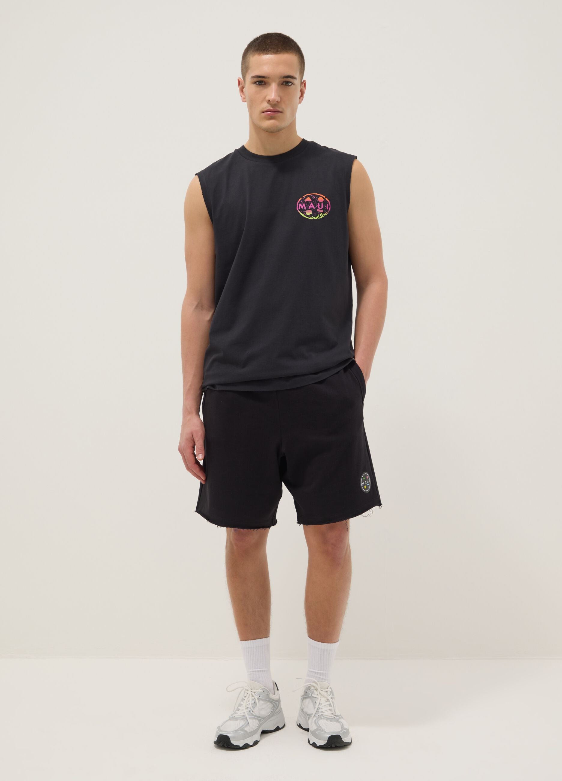 Black pure cotton relaxed-fit Bermuda shorts with raw-cut hems