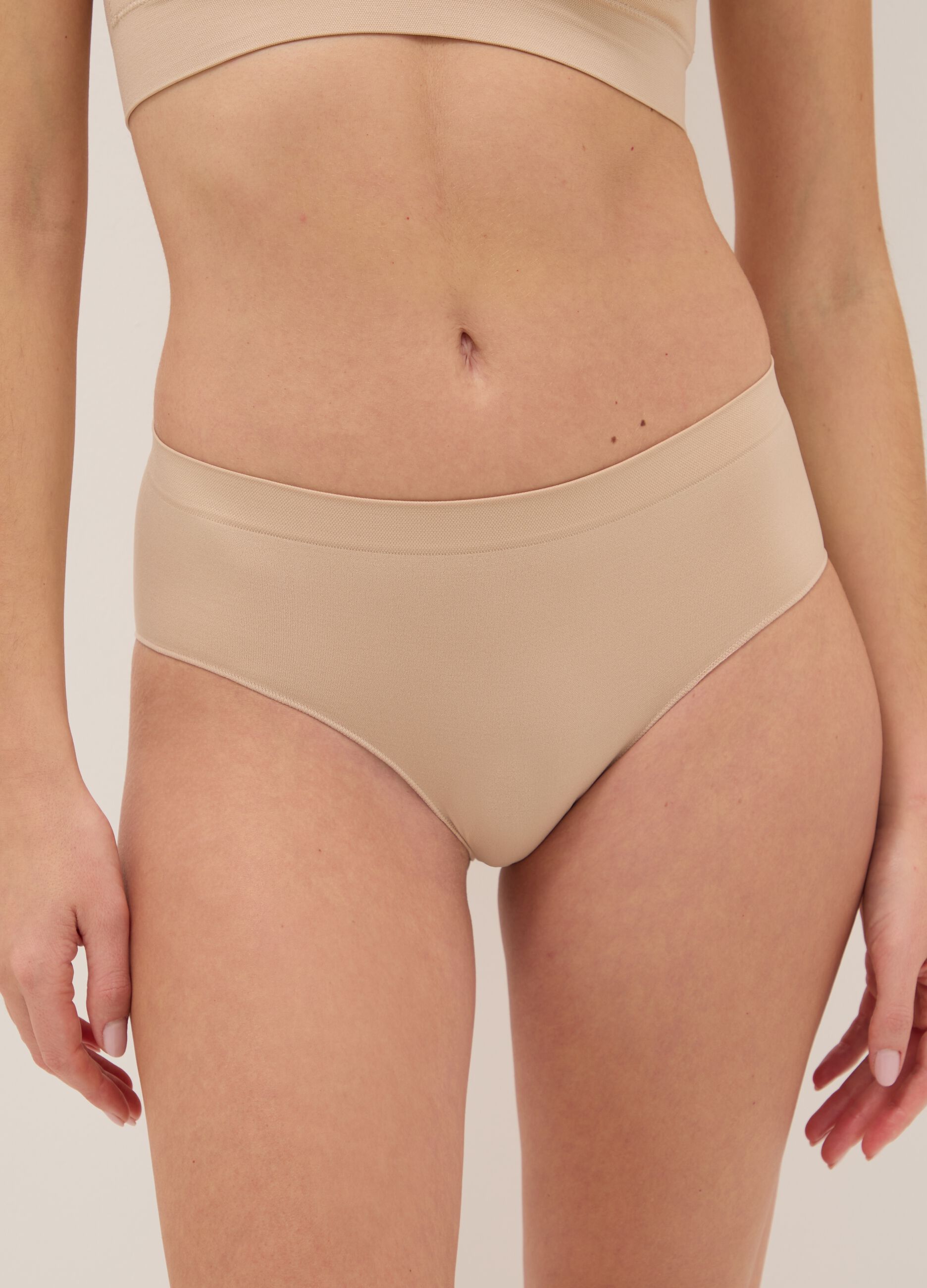 High-waisted beige briefs