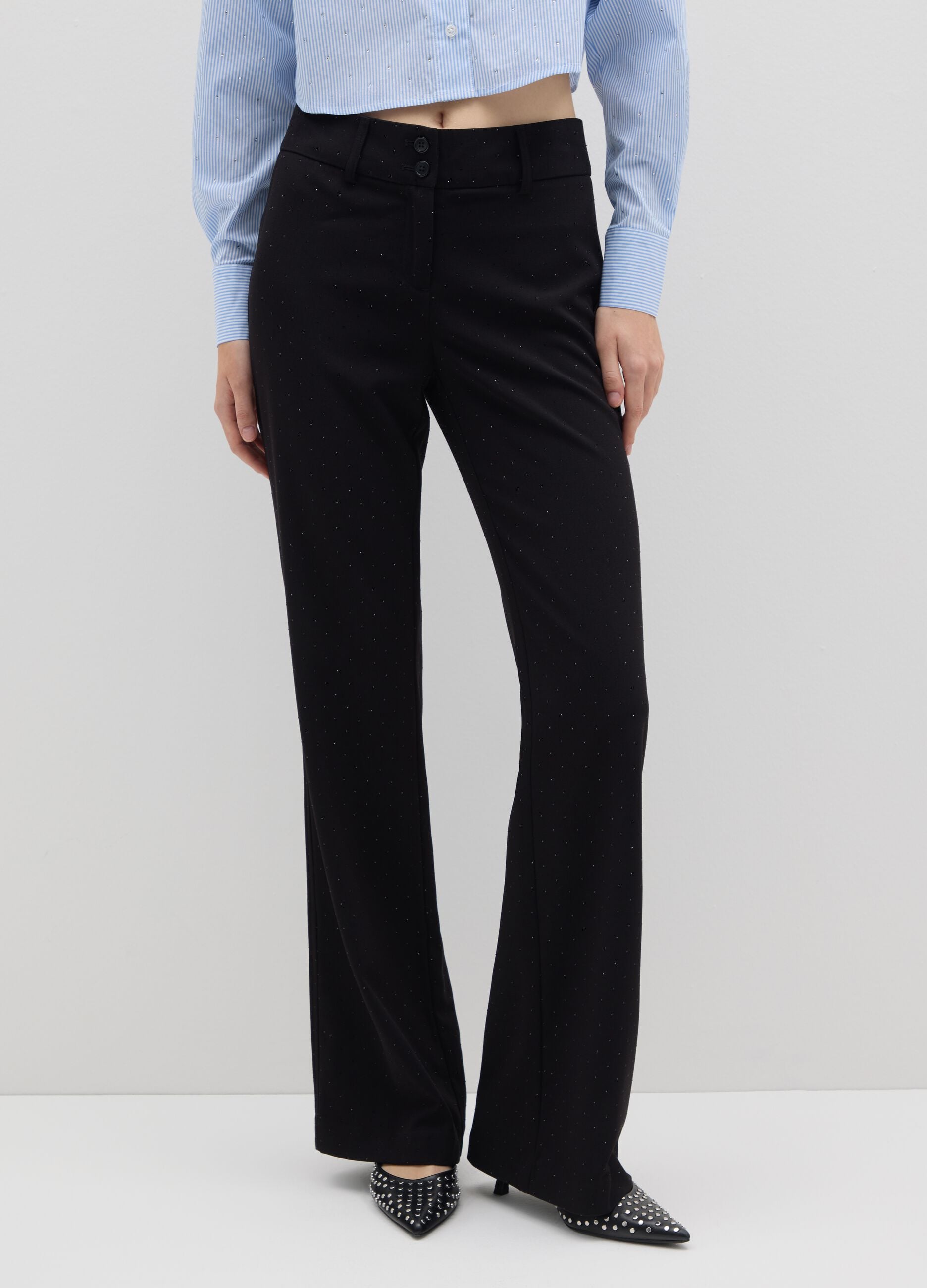 Black polka dot flare trousers