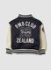 Blue varsity jacket with beige sleeves and print for boys_5