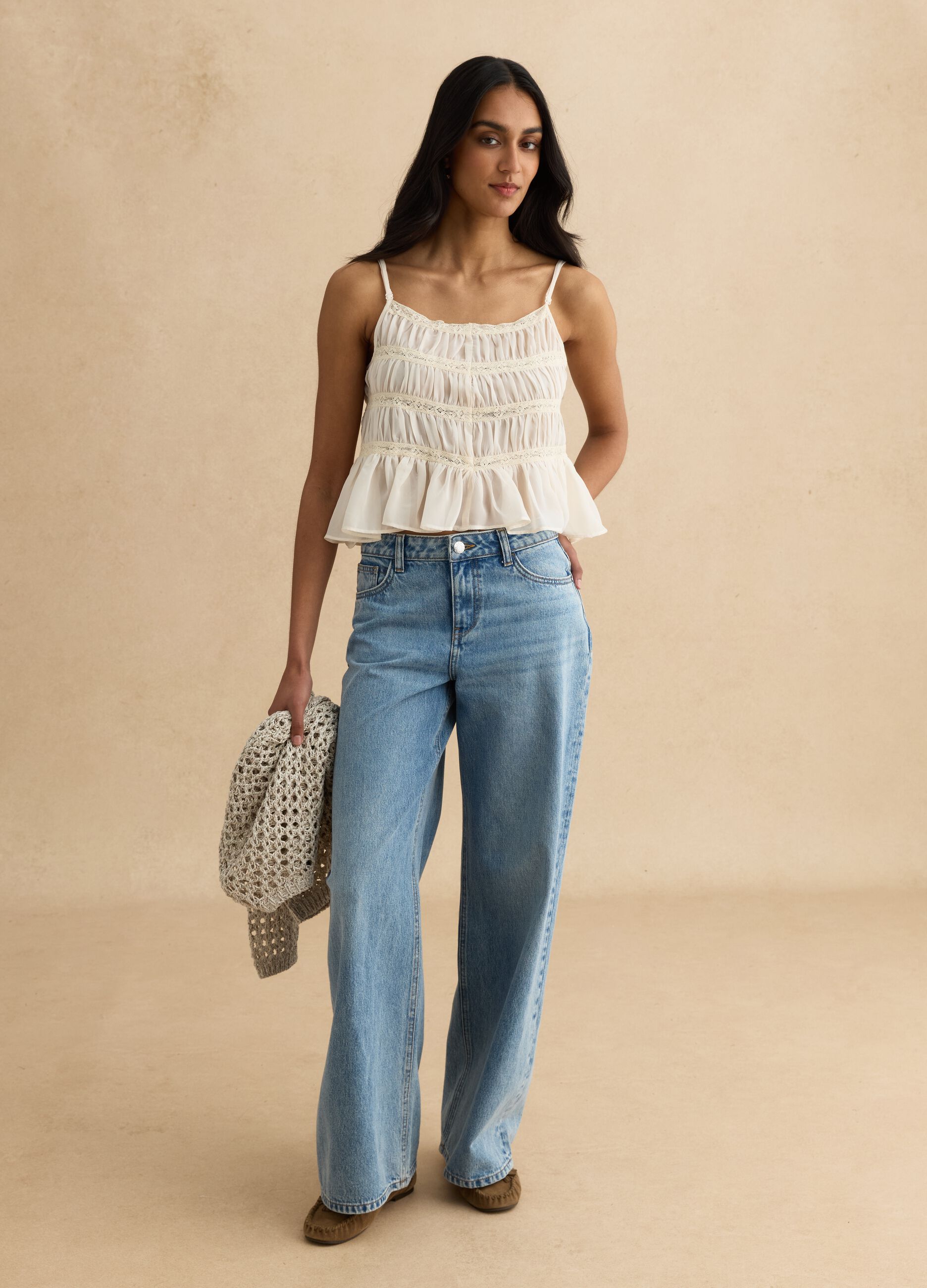 Sleeveless top with ruffled shirring and crochet lace inserts