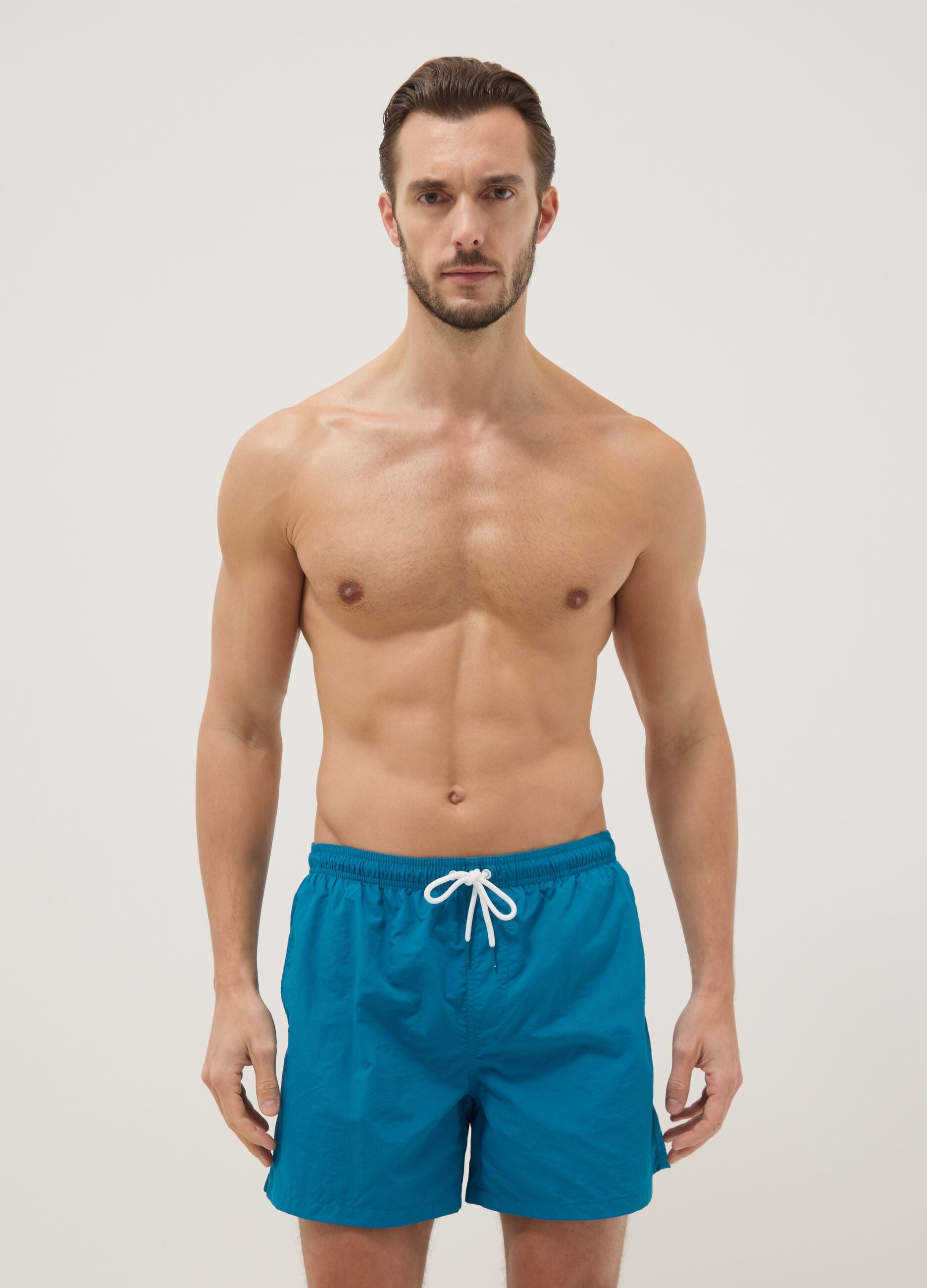 Blue swim shorts with elasticated waist