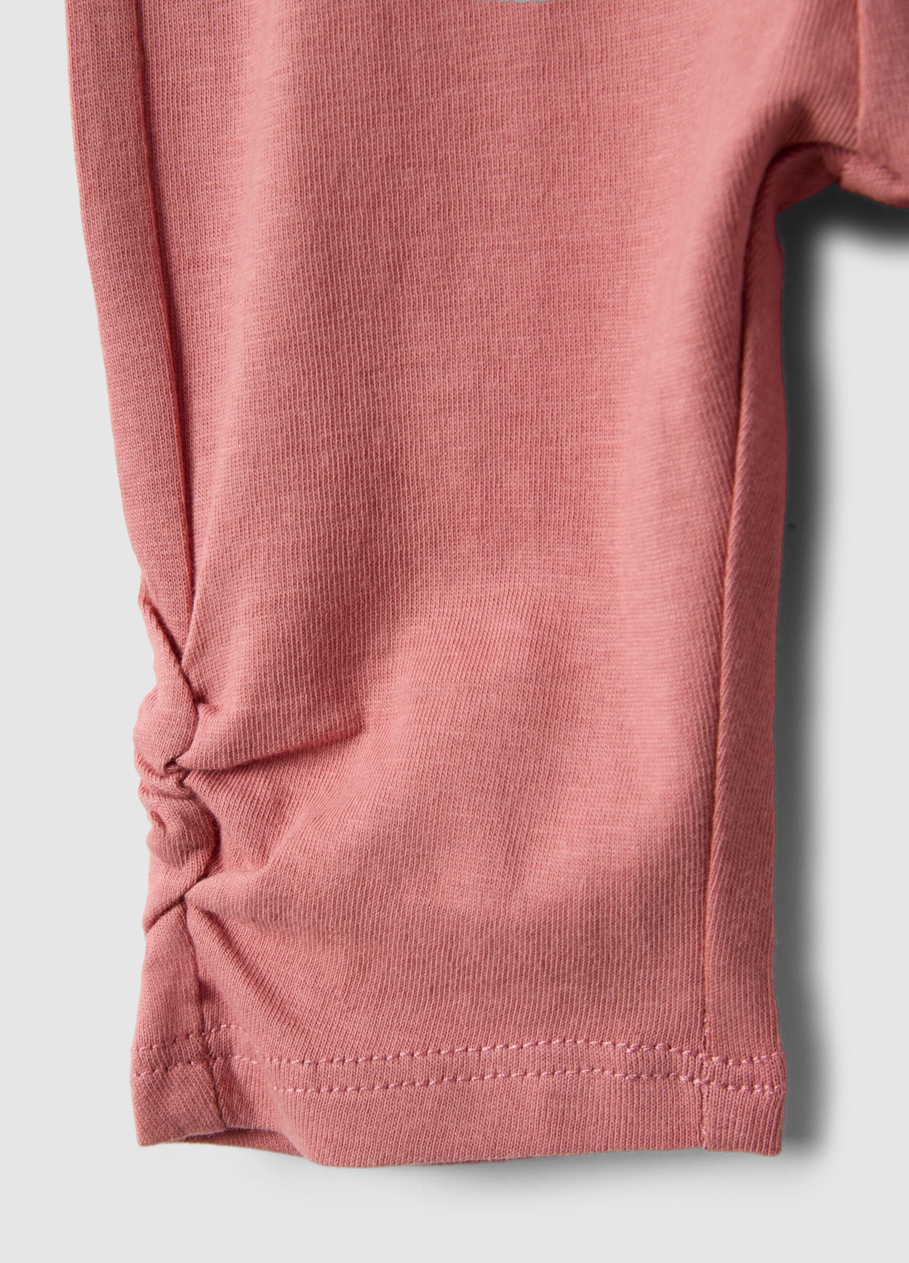 Slim fit pink cotton leggings for newborns with crumpled design