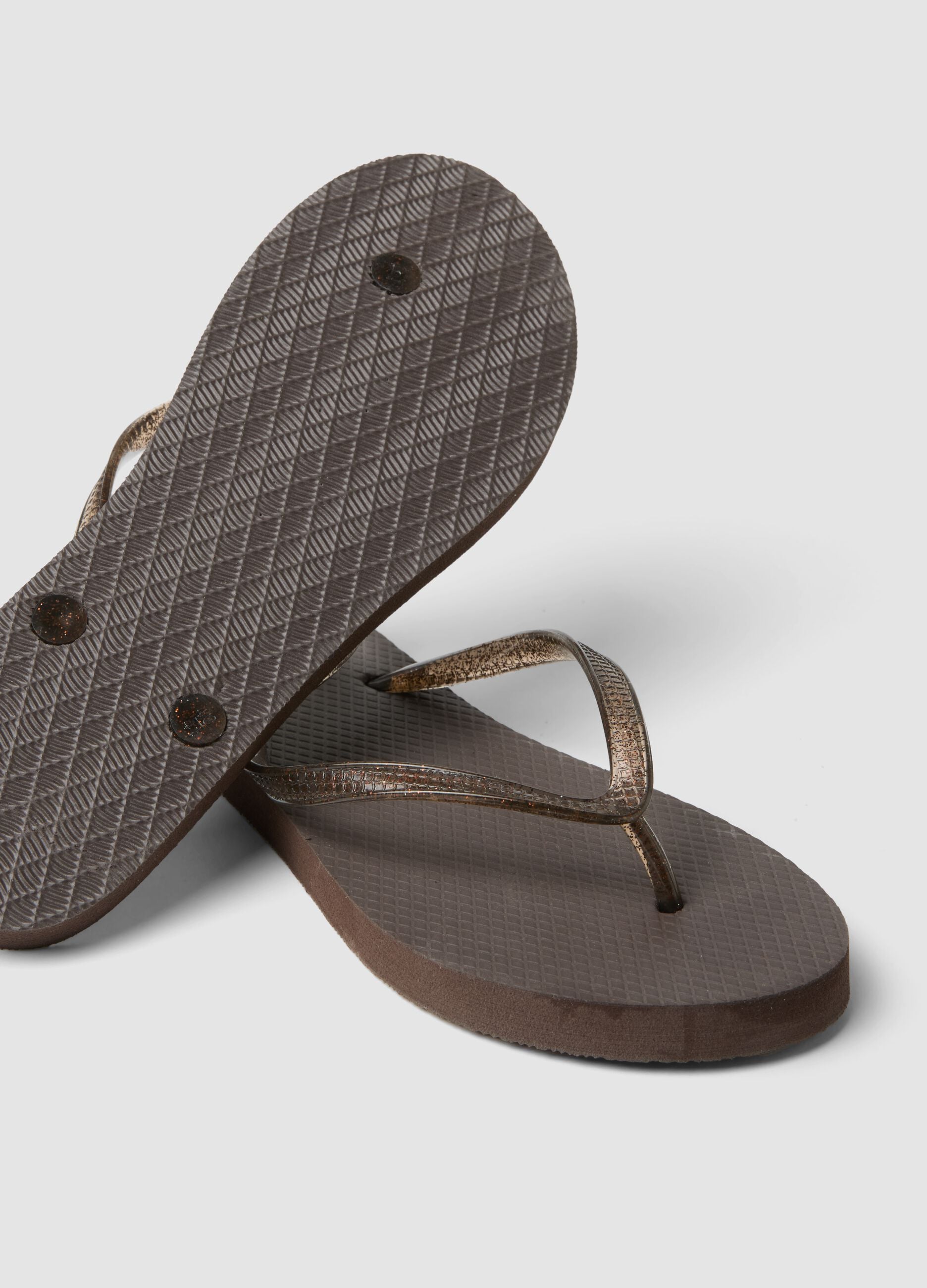 Brown flip-flops with translucent straps