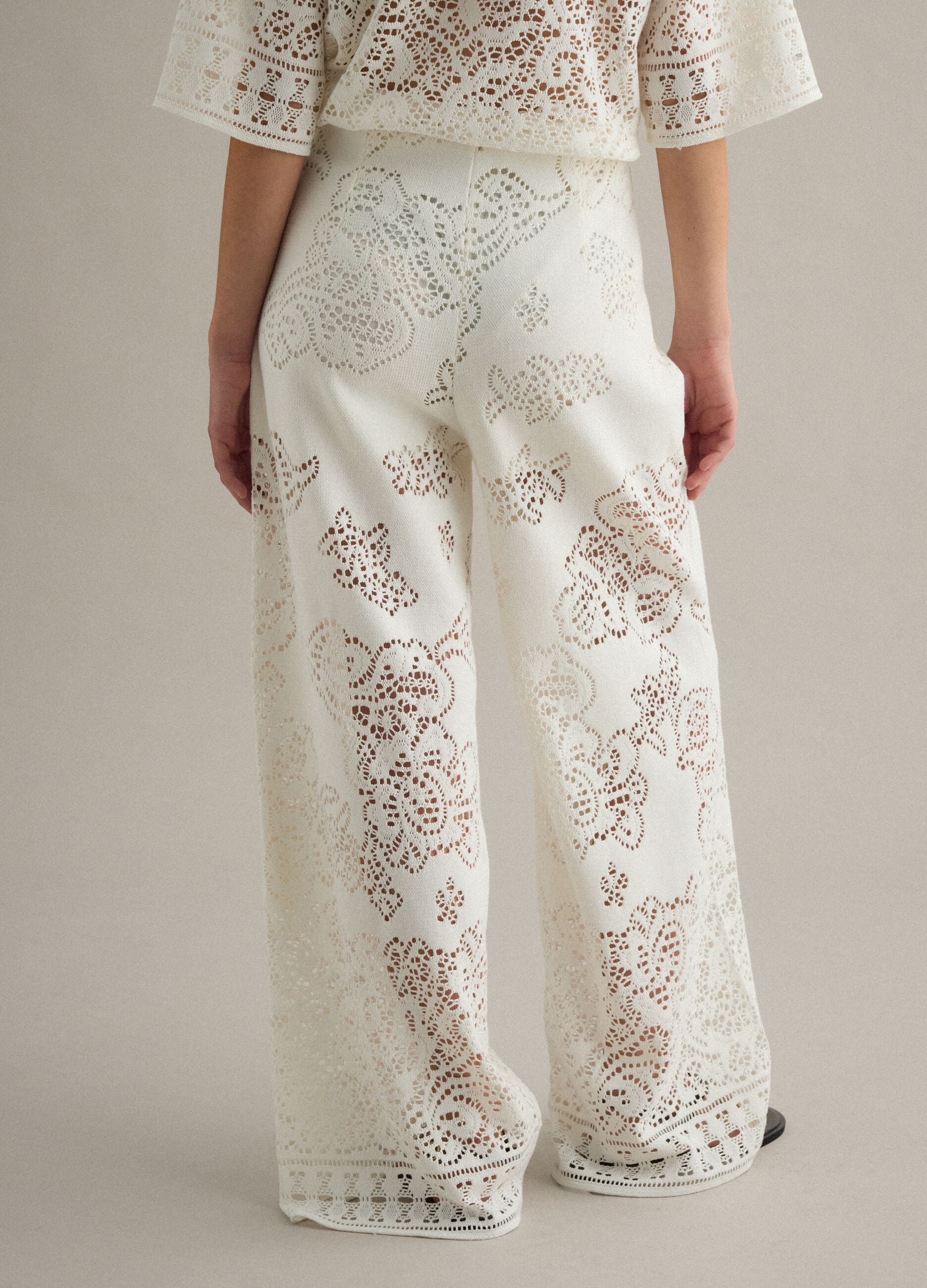 White wide leg cotton blend trousers with perforated texture