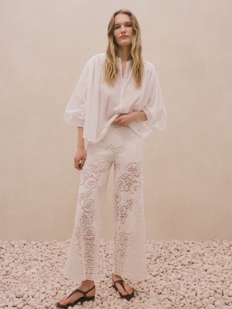 White wide leg cotton blend trousers with perforated texture_0
