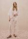 White wide leg cotton blend trousers with perforated texture_0