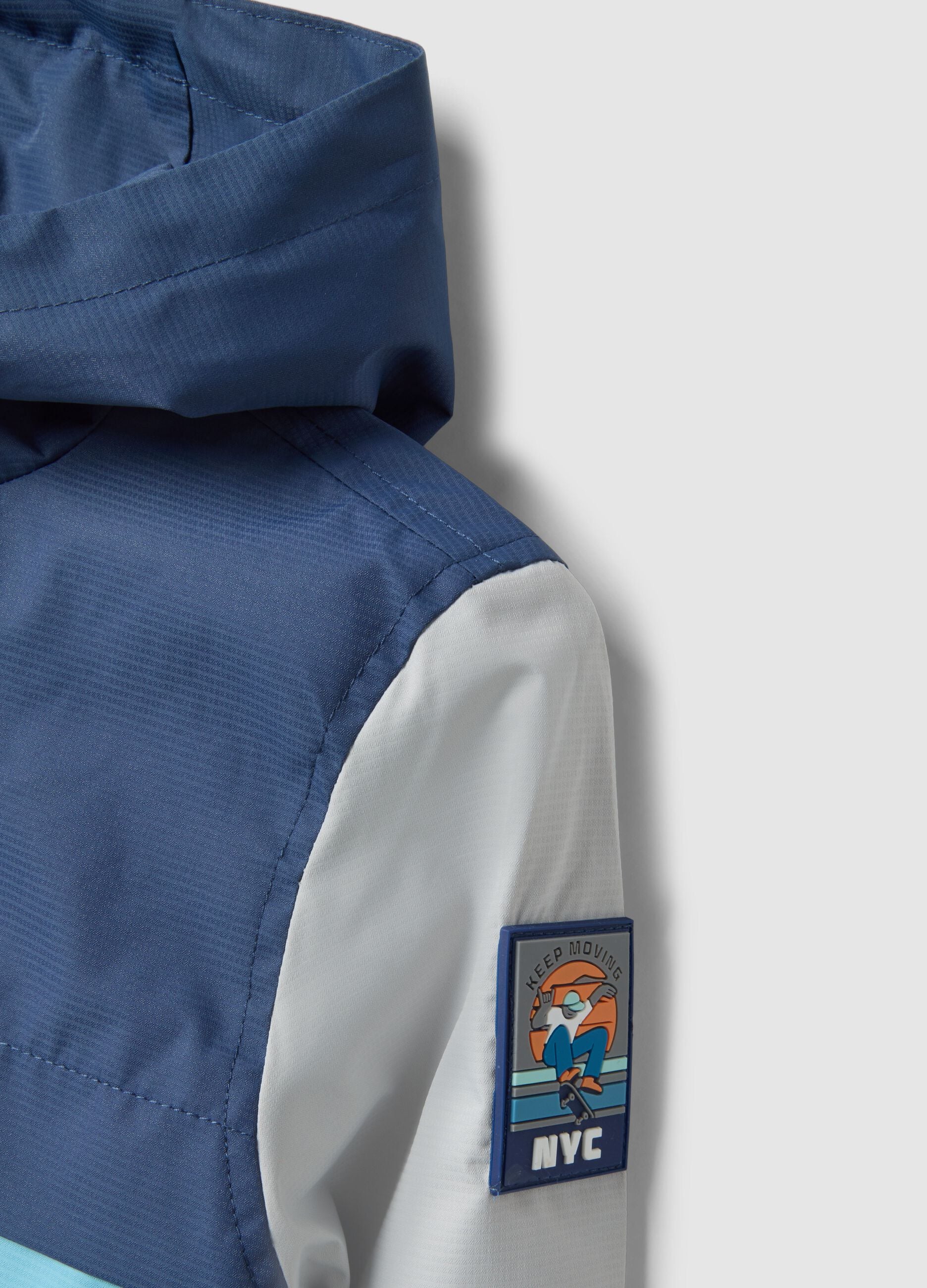 Multicoloured waterproof jacket with hood and zip for children